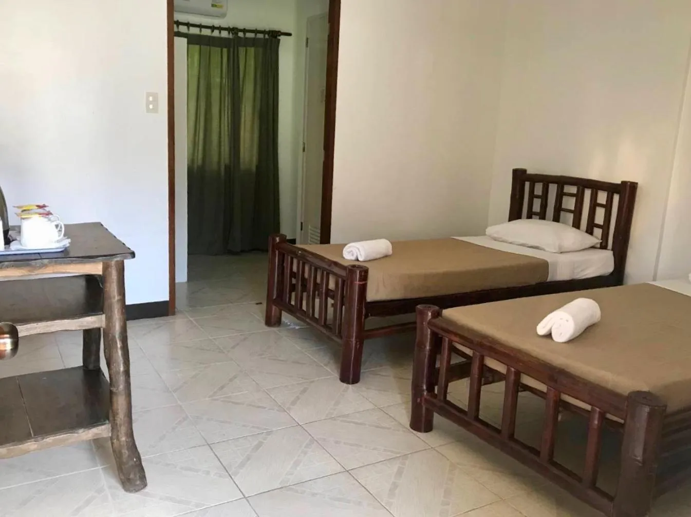 Bed in CHIISAI NATSU RESORT