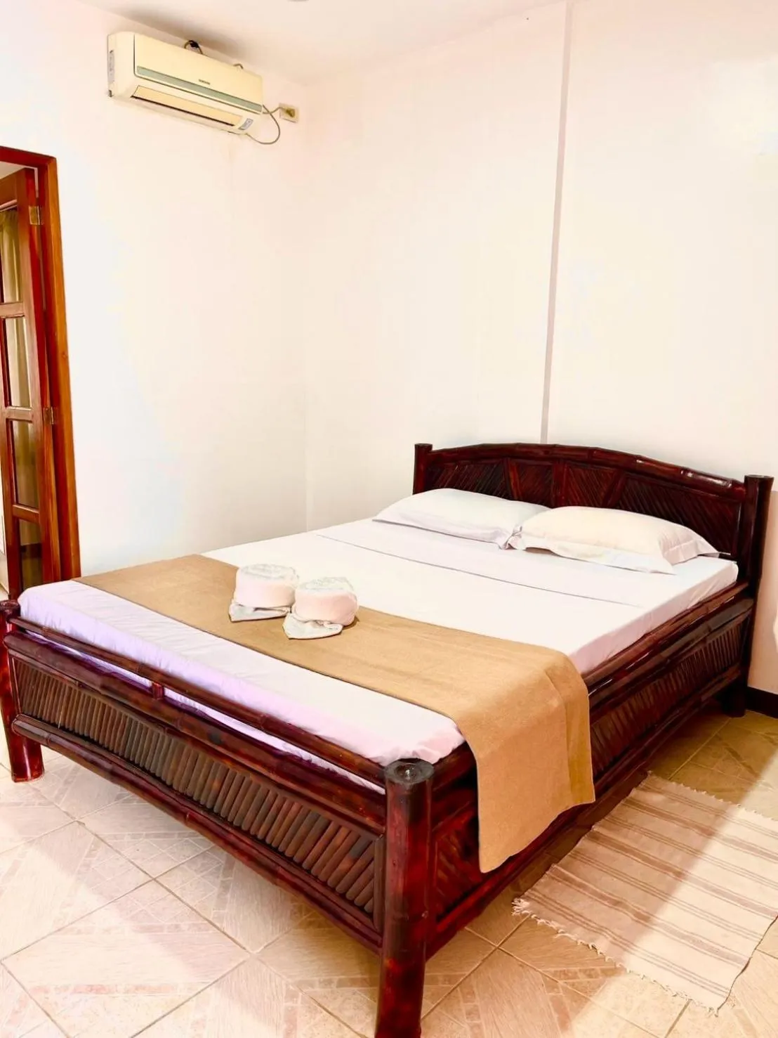 Bed in CHIISAI NATSU RESORT