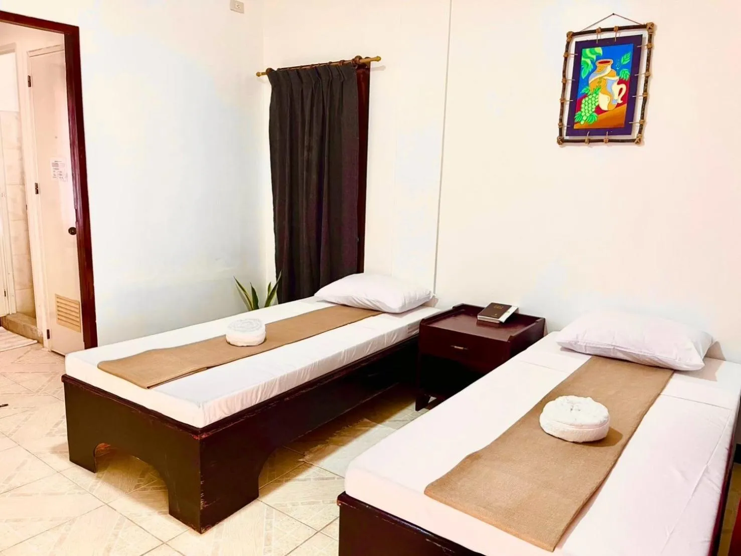 Bed in CHIISAI NATSU RESORT