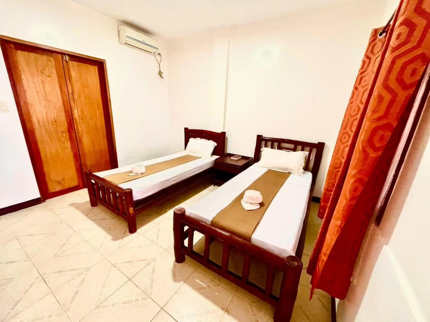 Bed in CHIISAI NATSU RESORT