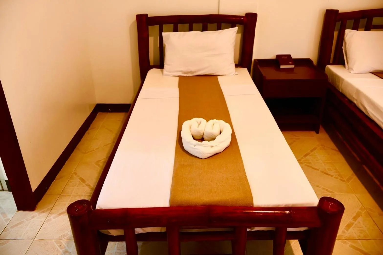 Bed in CHIISAI NATSU RESORT