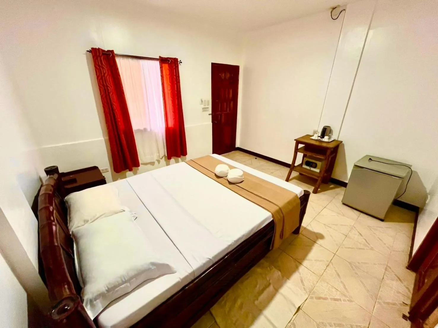 Bed in CHIISAI NATSU RESORT