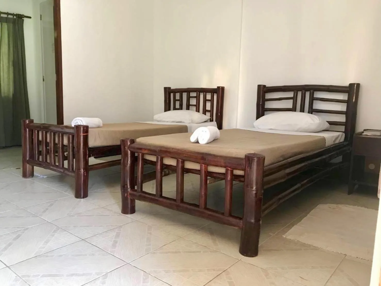 Bed in CHIISAI NATSU RESORT