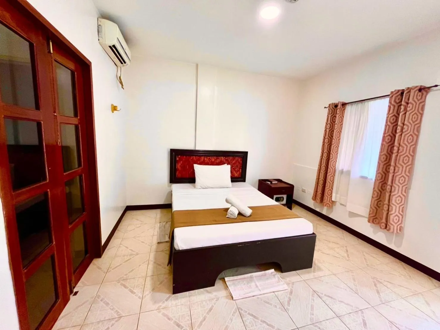 Bed in CHIISAI NATSU RESORT