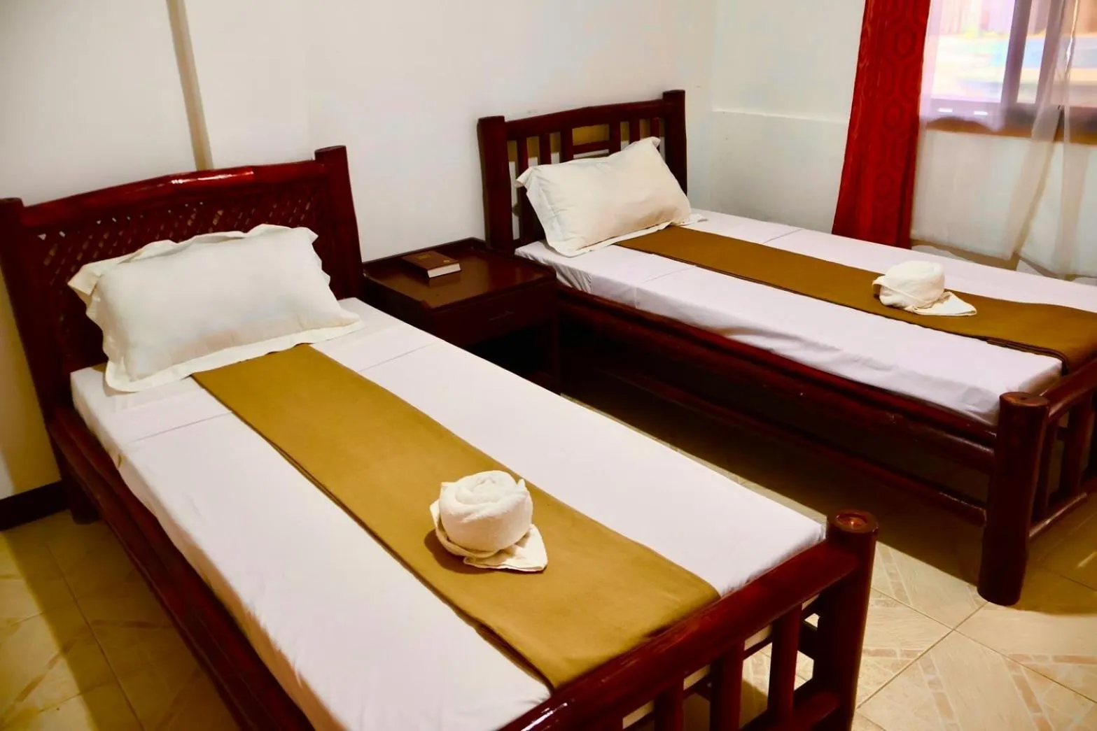 Bed in CHIISAI NATSU RESORT