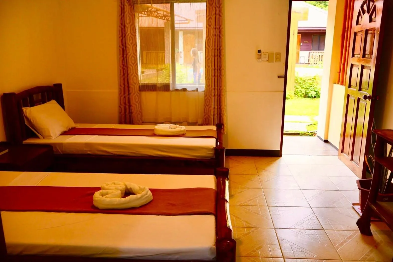 Bed in CHIISAI NATSU RESORT