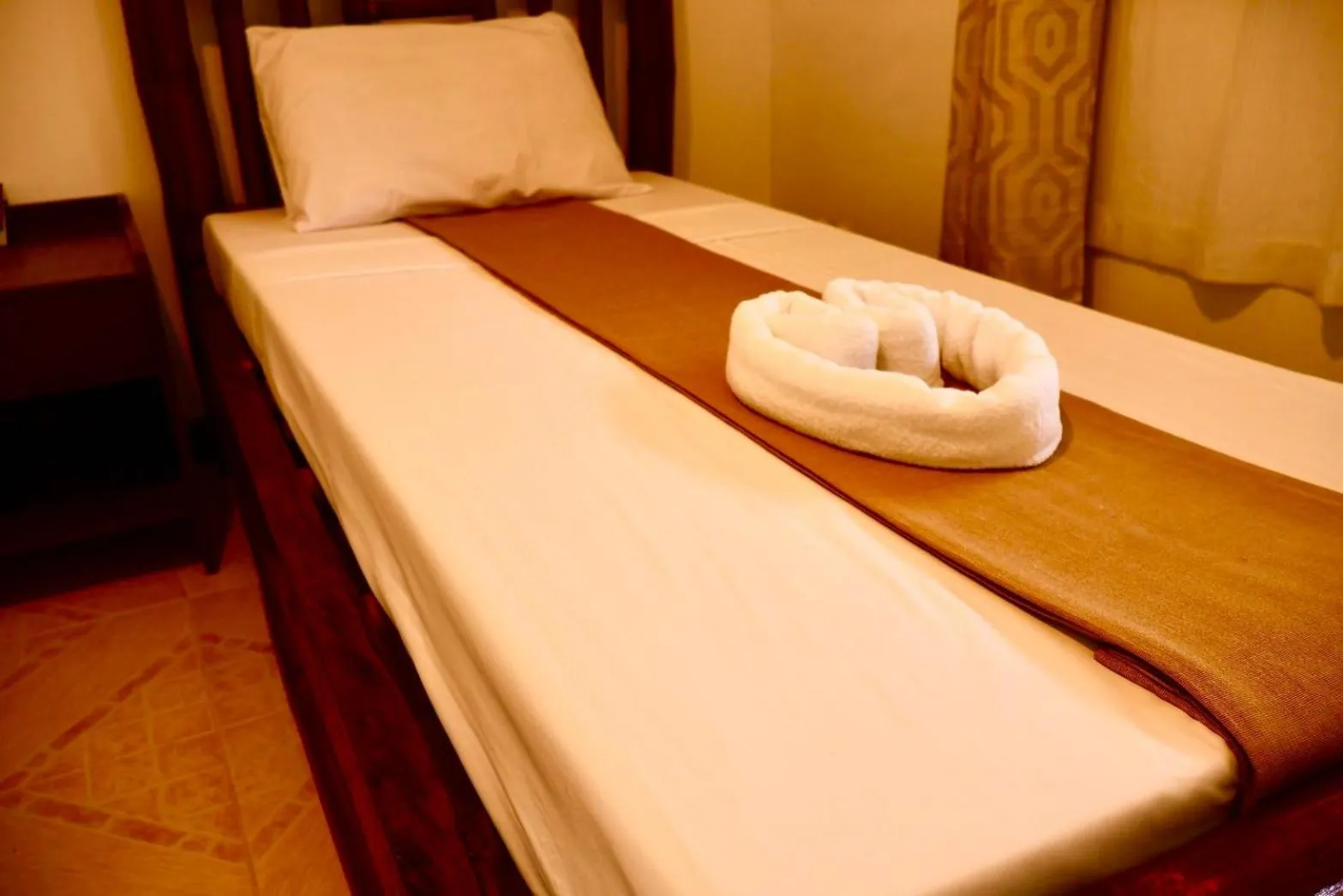 Bed in CHIISAI NATSU RESORT