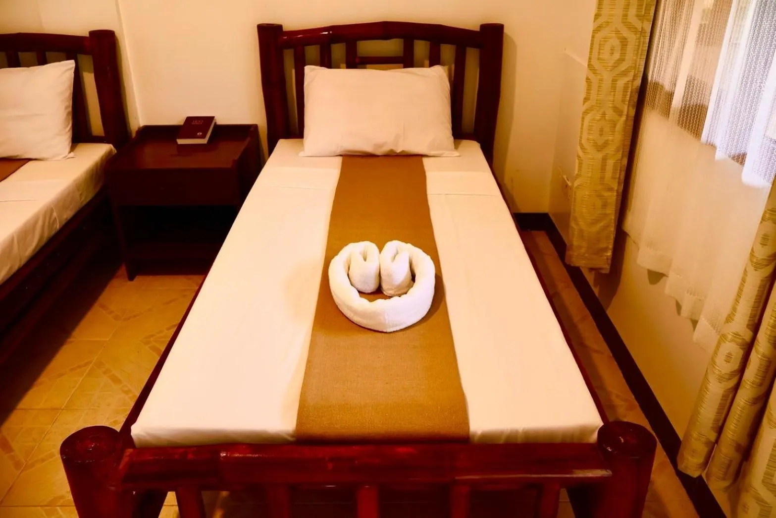 Bed in CHIISAI NATSU RESORT