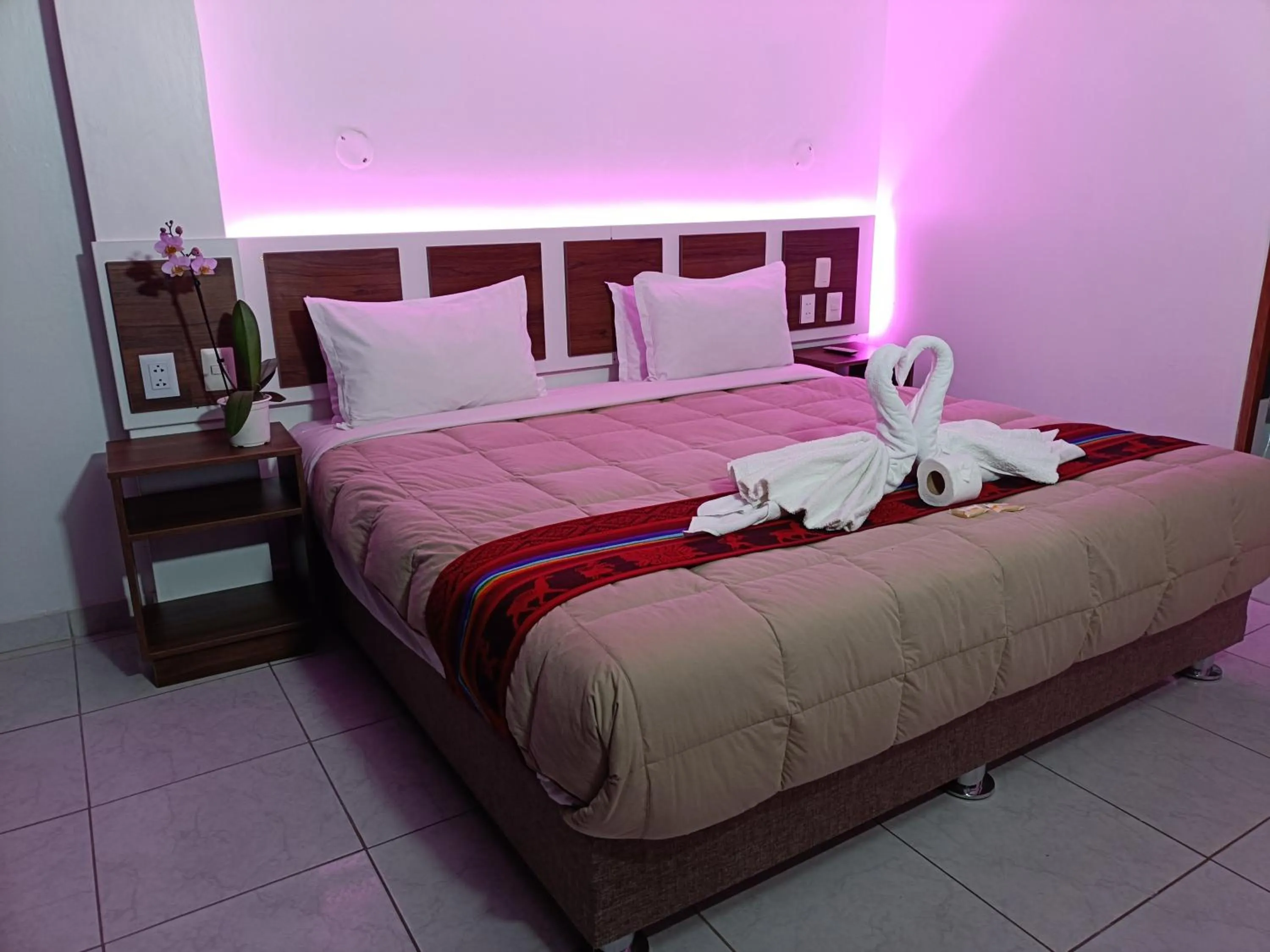 Bed in PAKARINA HOTEL