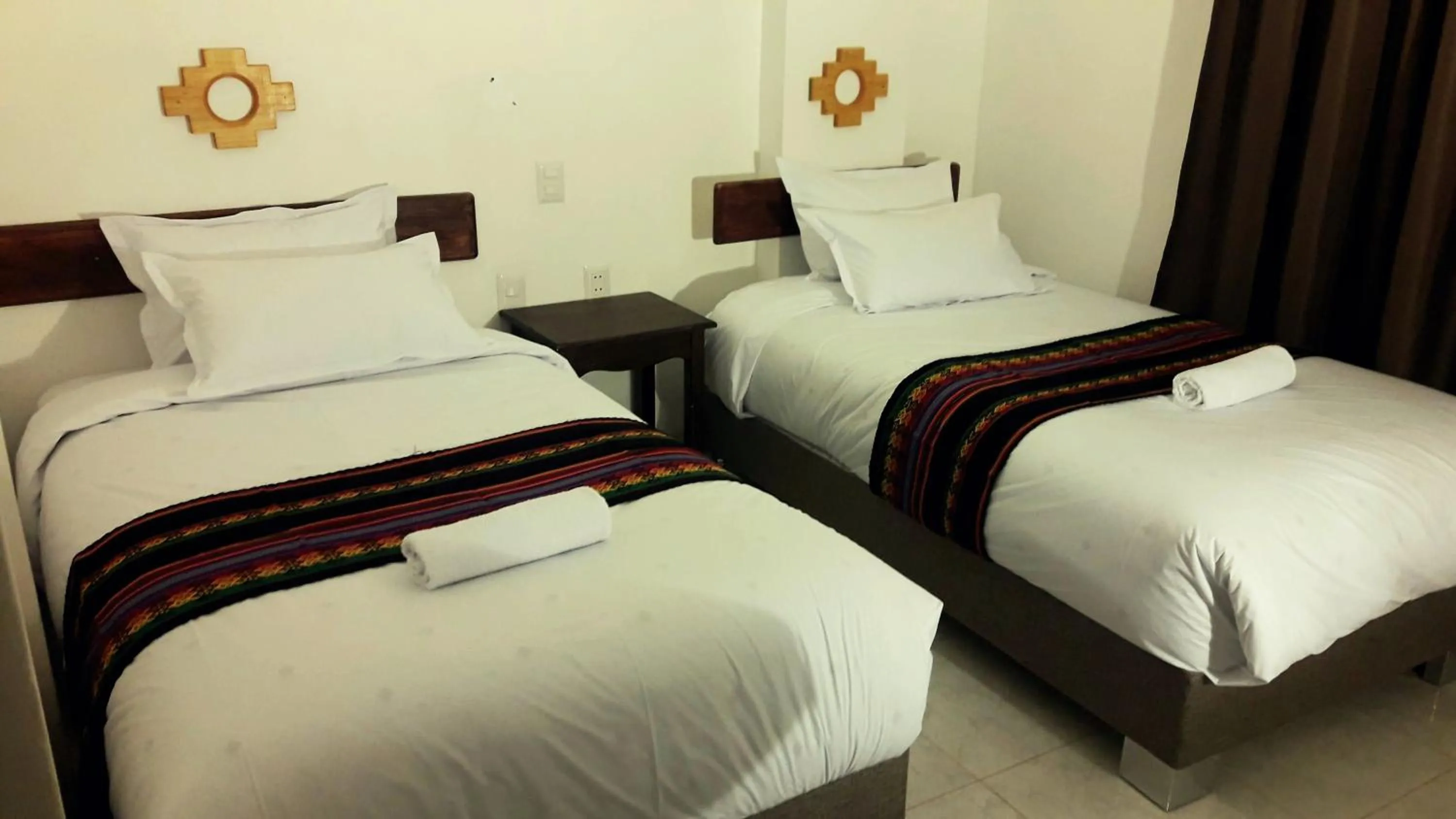 Bed in PAKARINA HOTEL