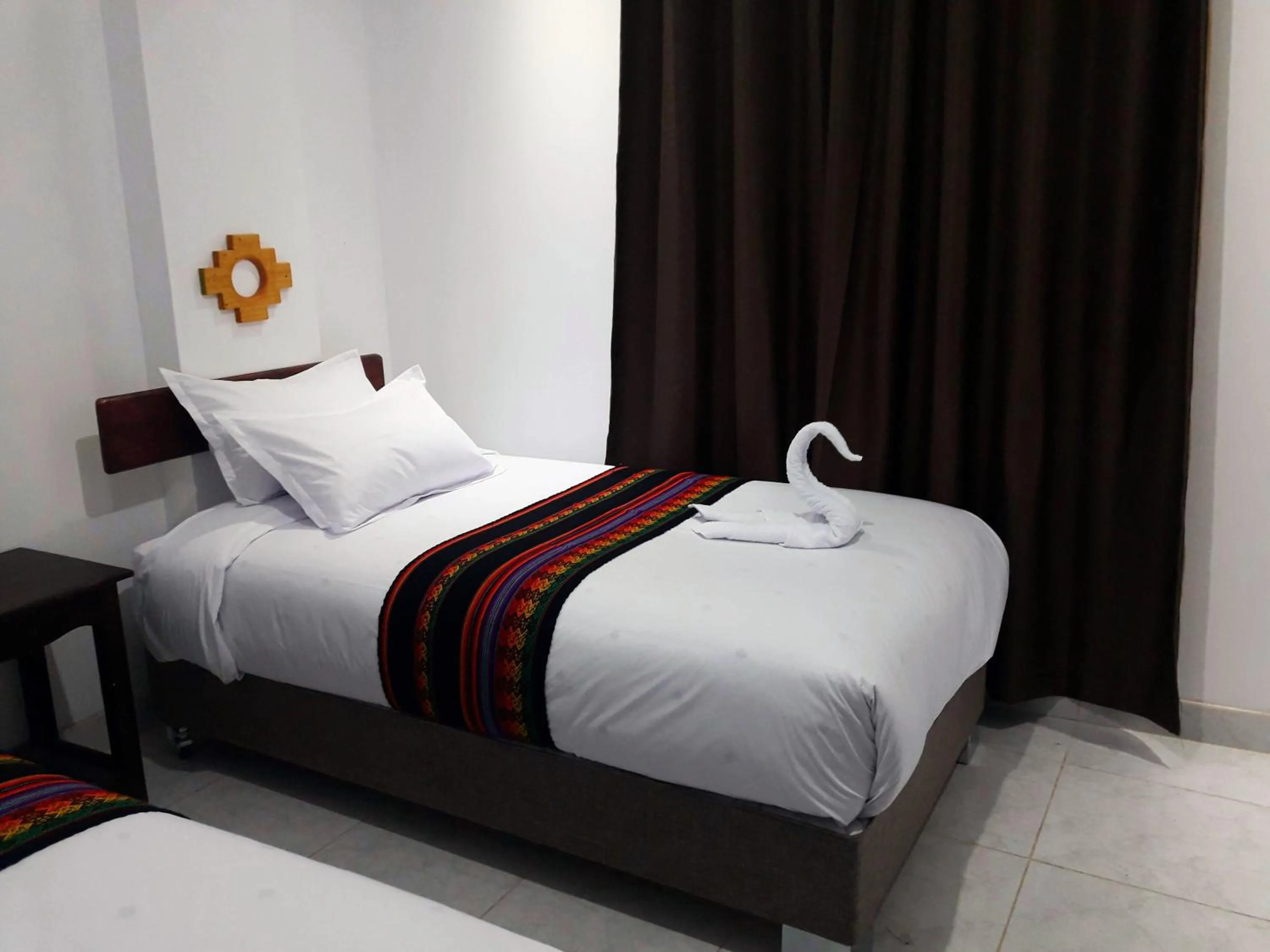 Bed in PAKARINA HOTEL
