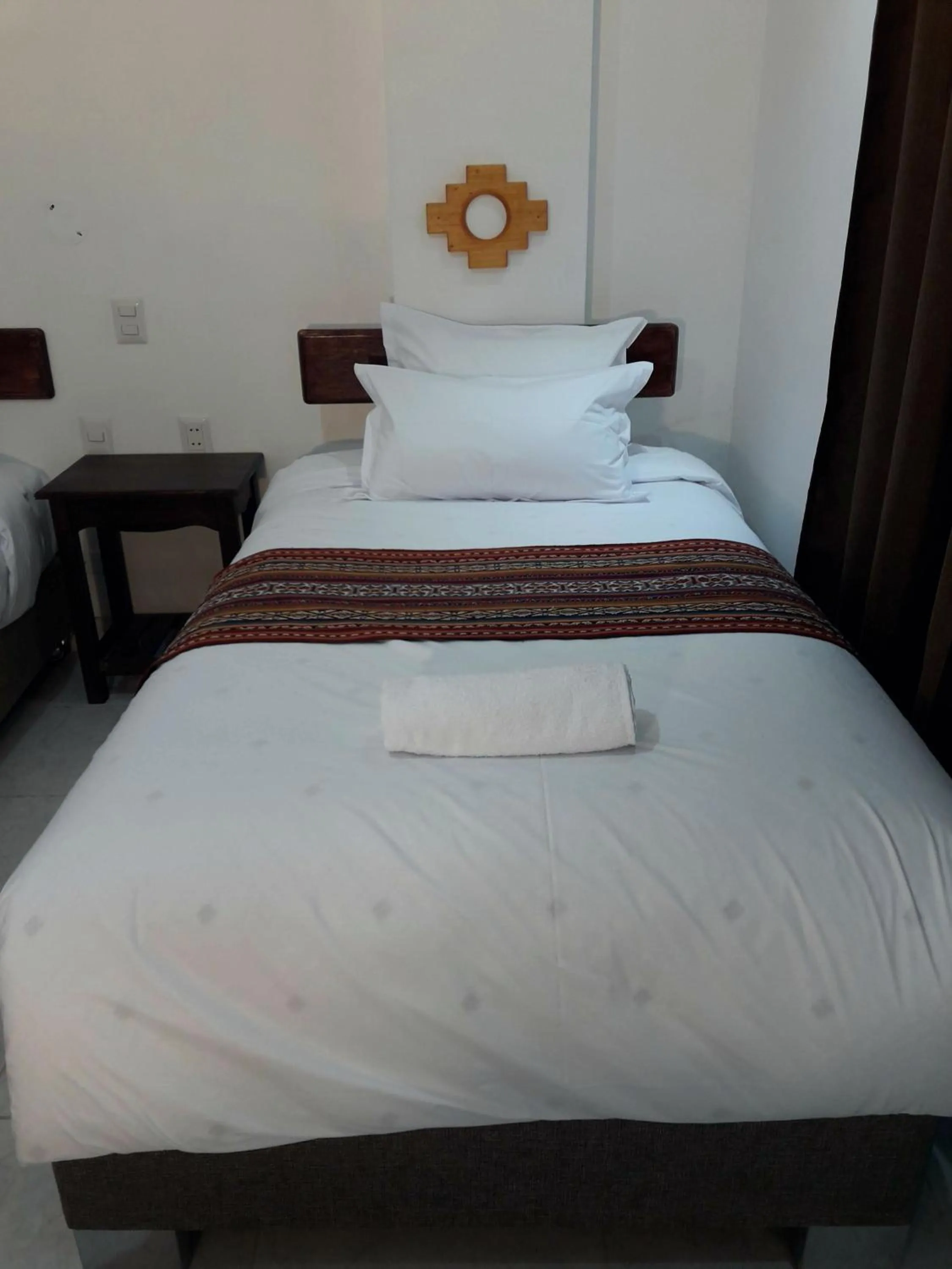 Bed in PAKARINA HOTEL