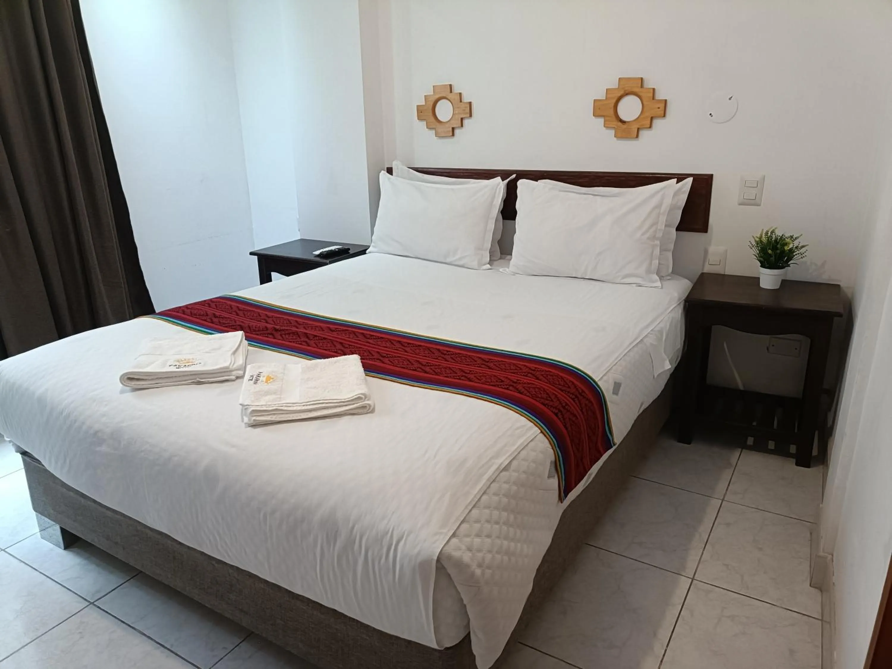 Bed in PAKARINA HOTEL