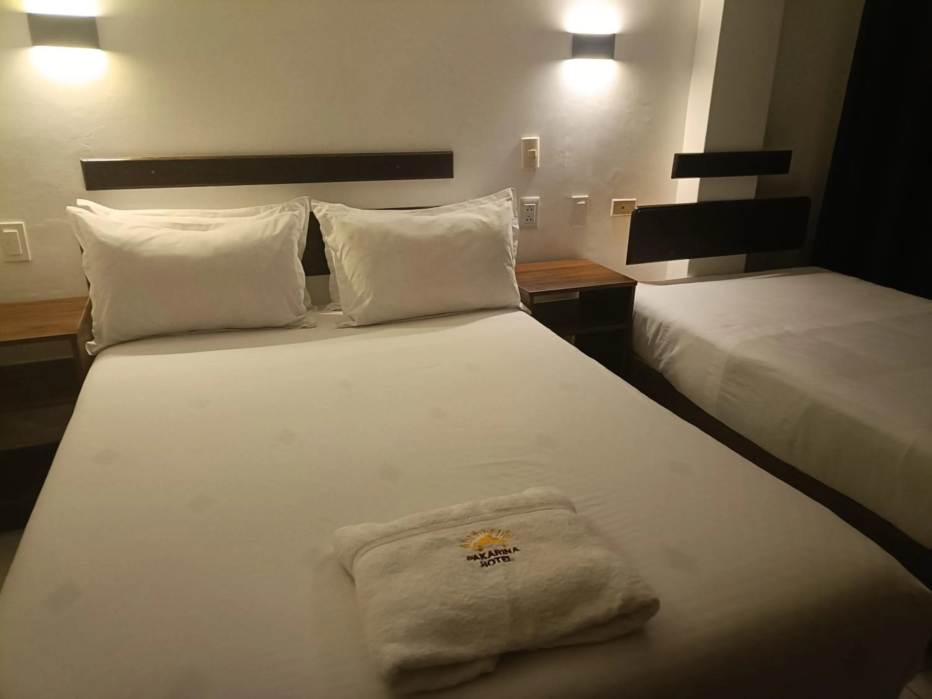 Bed in PAKARINA HOTEL