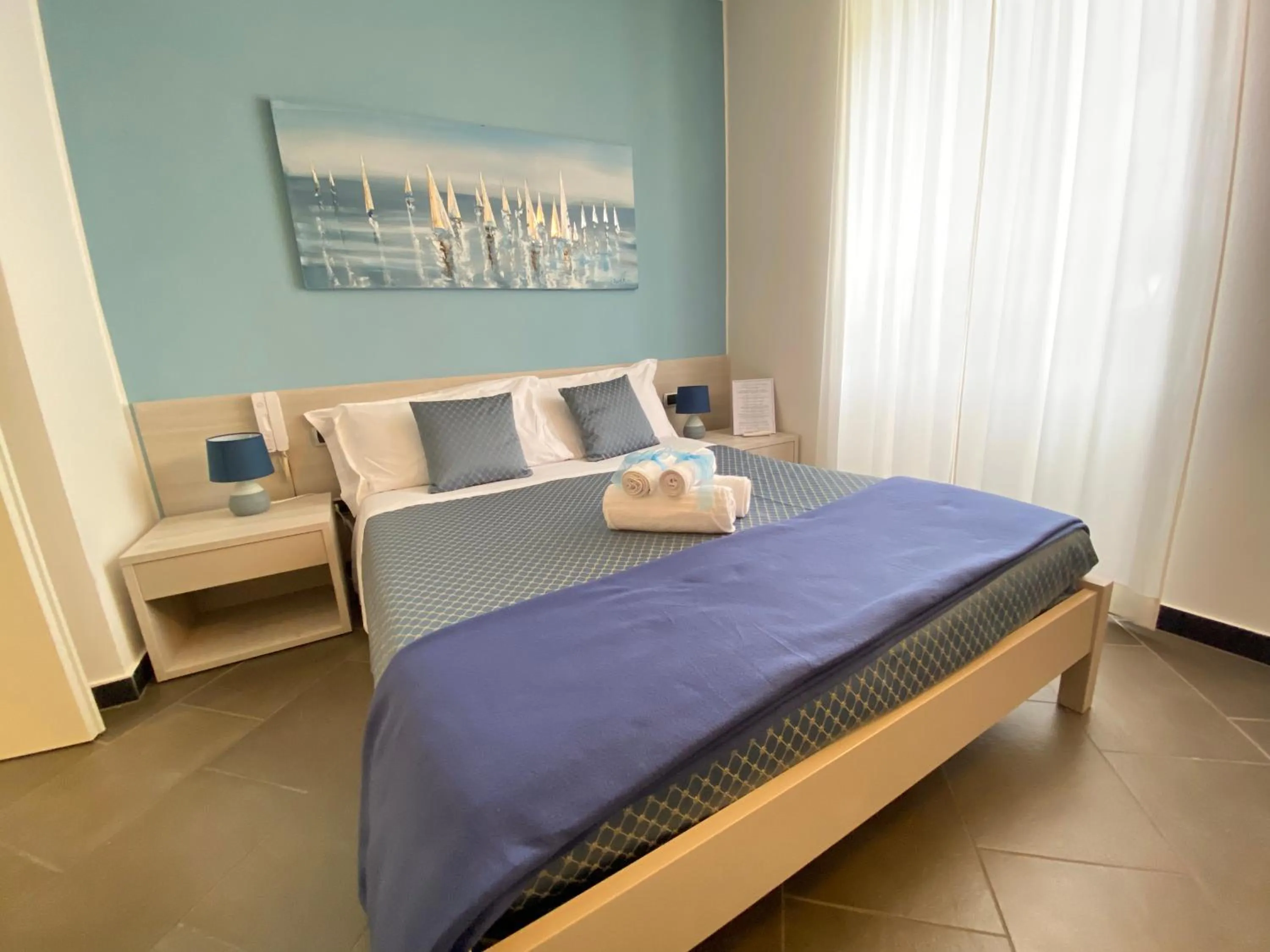 Photo of the whole room, Bed in Pensione Sorriso