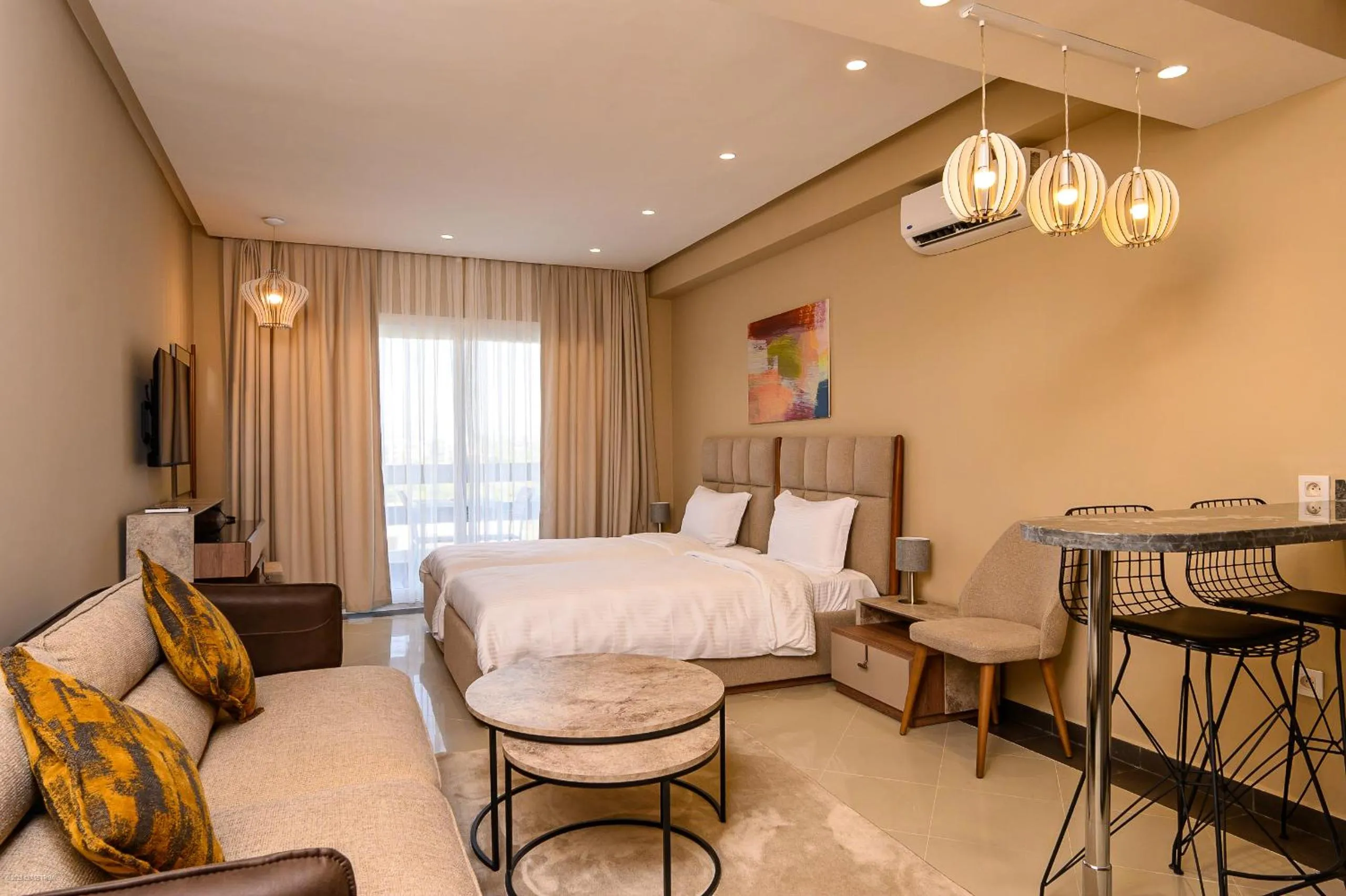 Living room, Bed in PLAYA DEL PACHA Suites Hotel