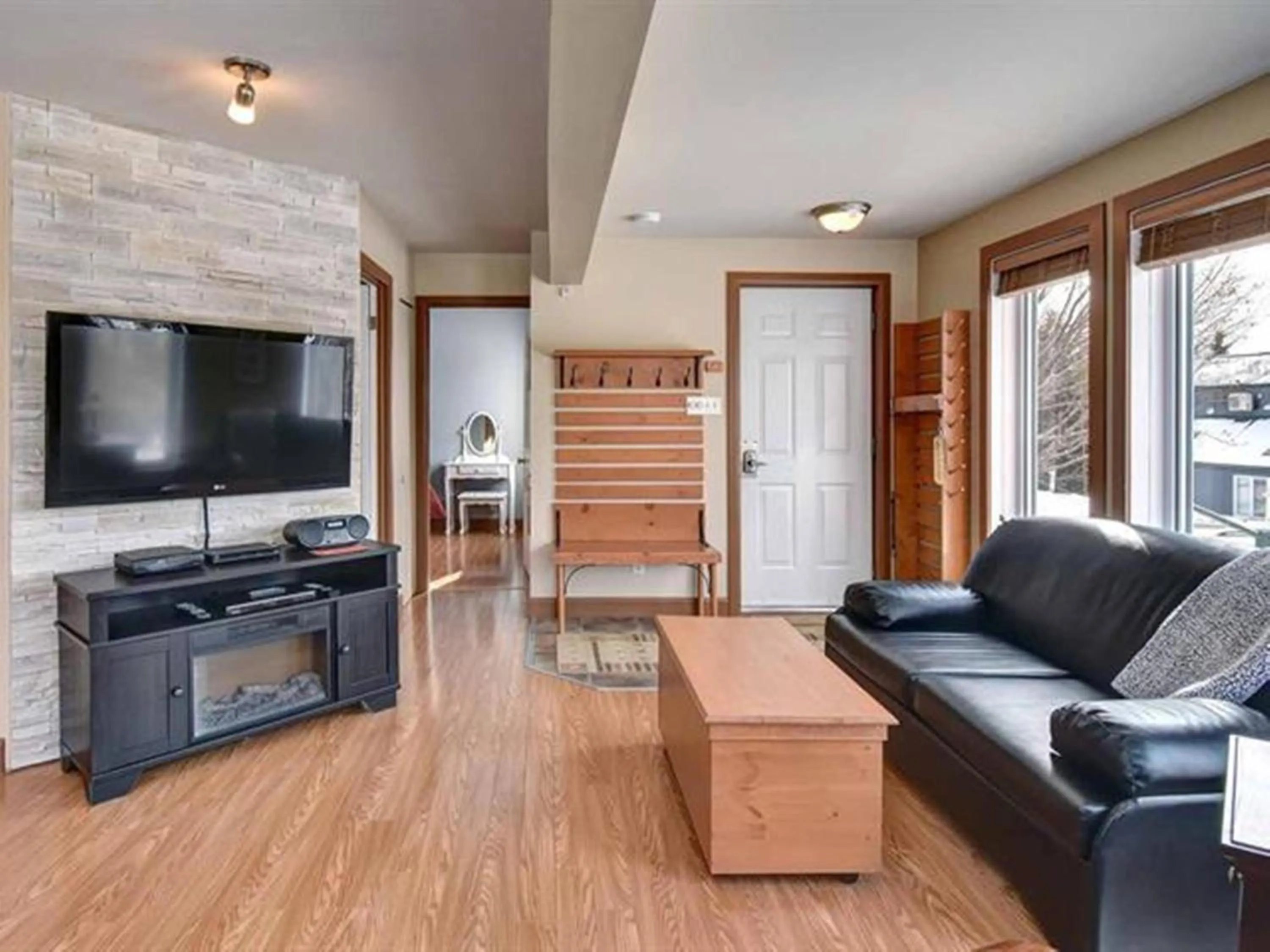 Living room in Bright Condo near the Lake by GLOBALSTAY