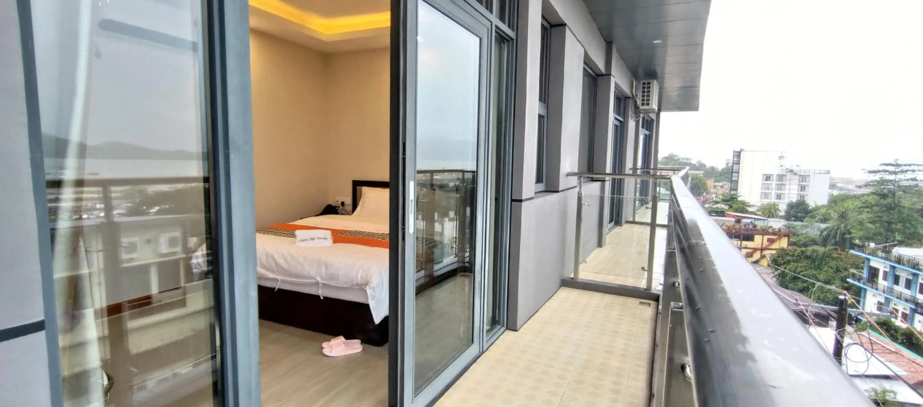 Balcony/Terrace, Bed in Sky Garden Hotel