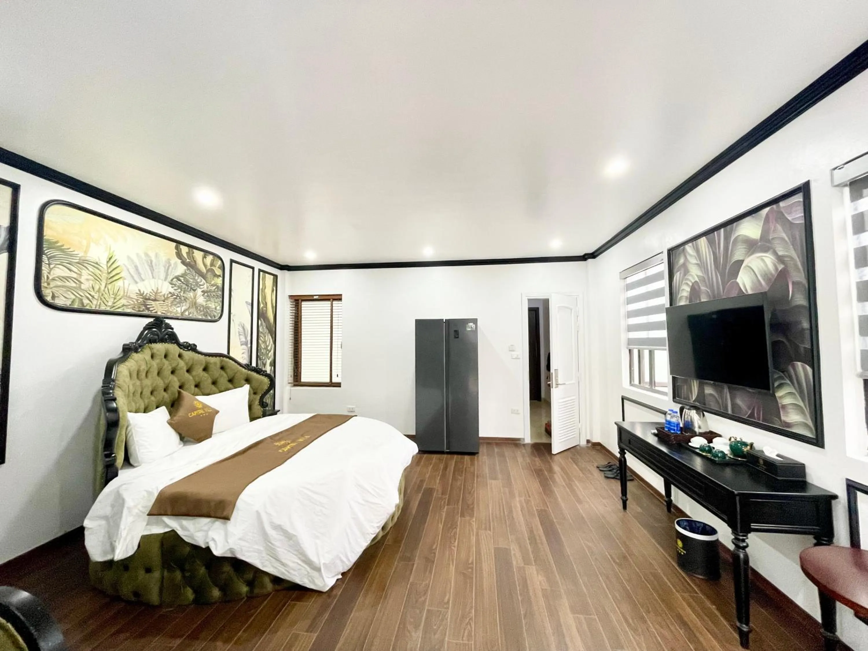 Living room, Bed in Capital CauGiay Hotel