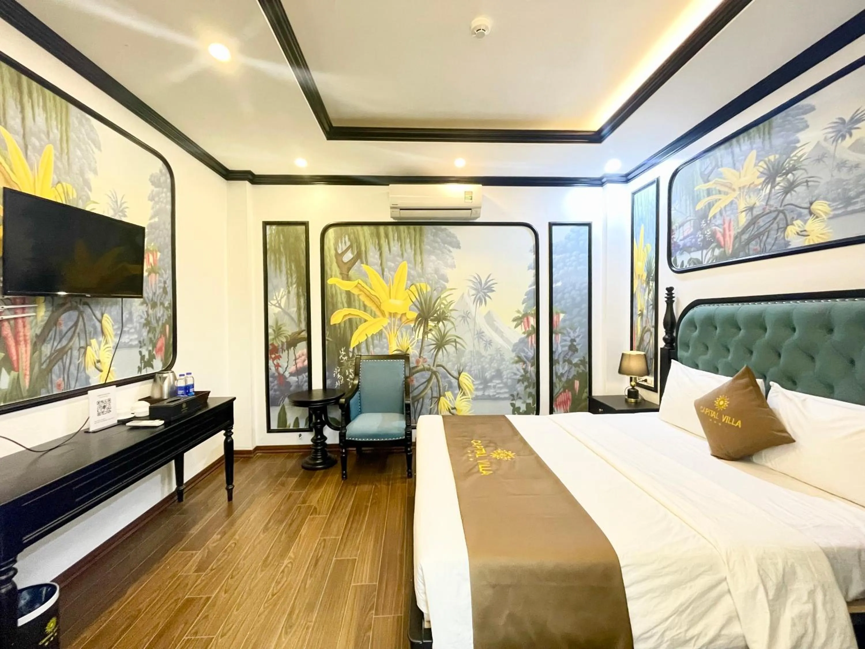 Communal lounge/ TV room, Bed in Capital CauGiay Hotel