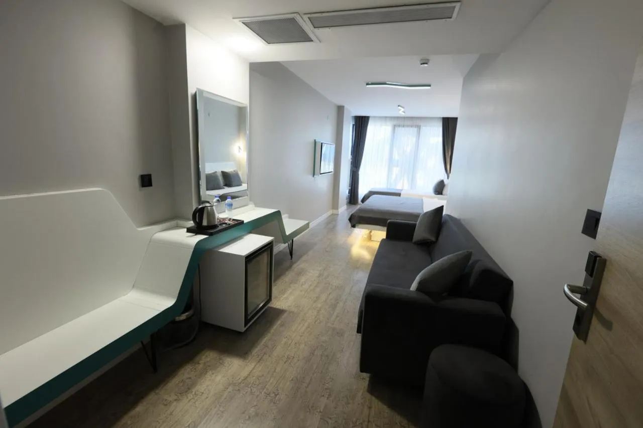 Seating area, Bed in Midis Otel