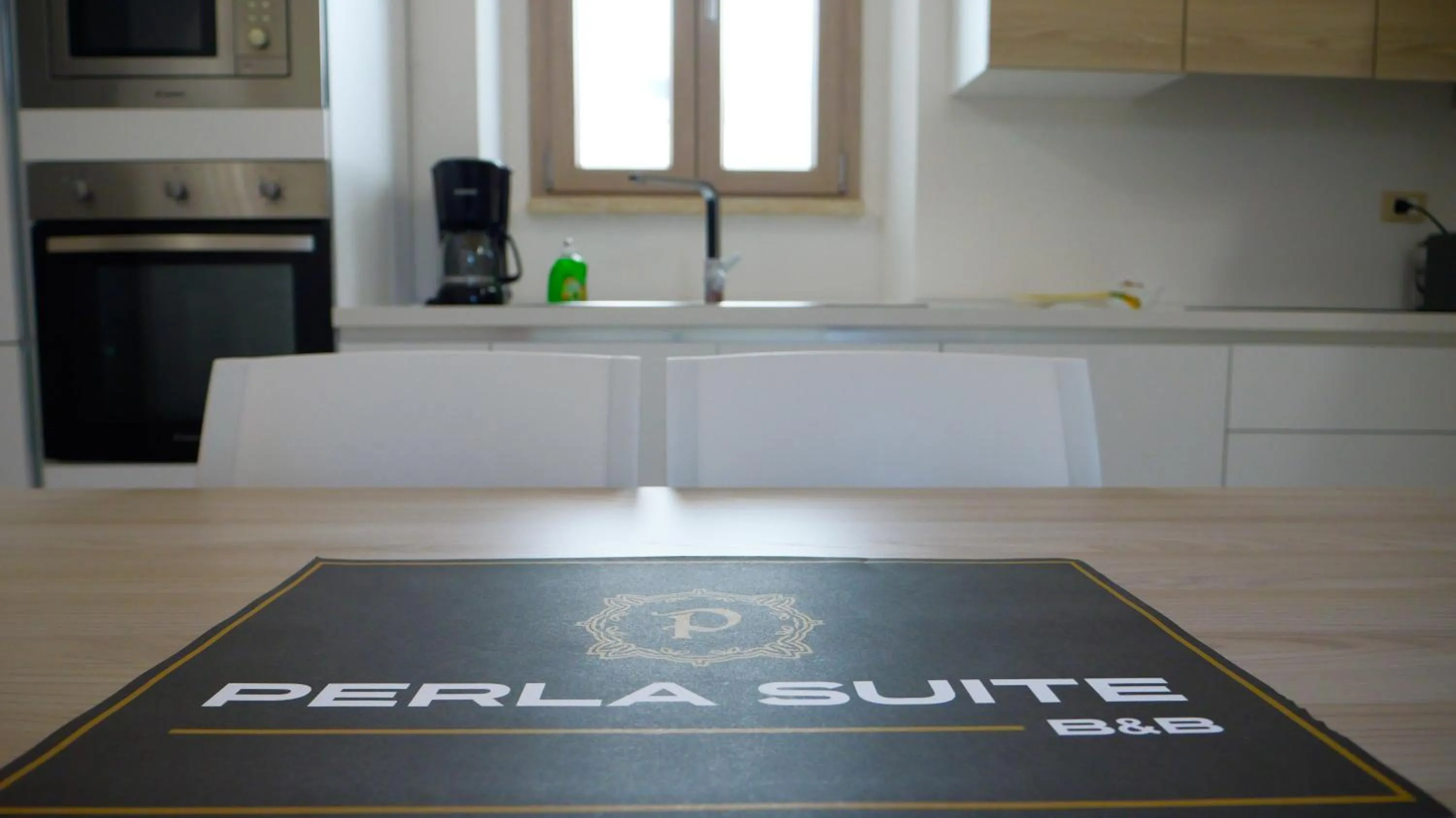 Kitchen or kitchenette in Perla Suite