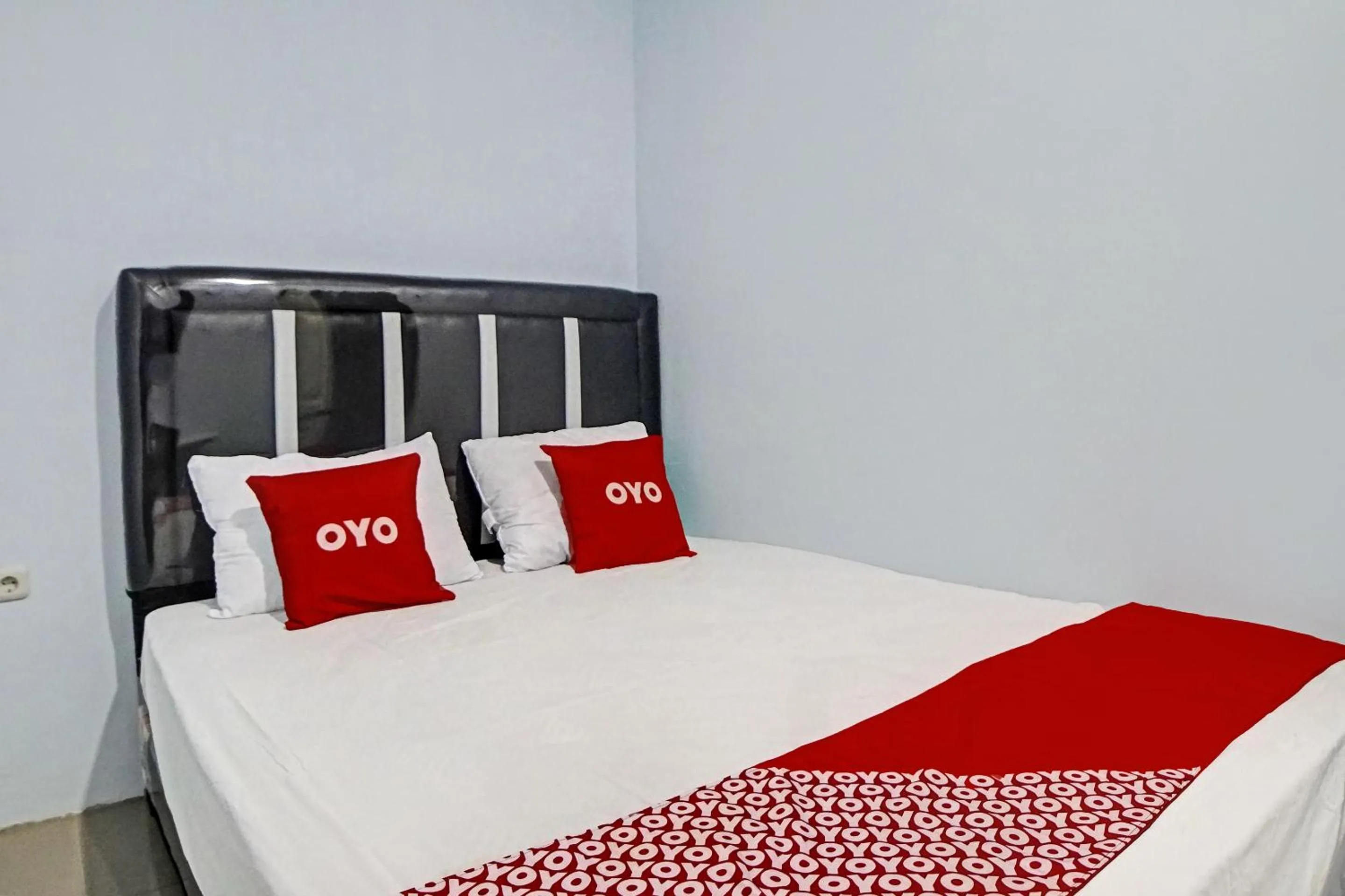 Bedroom in Hotel O Planet Guest House Syariah