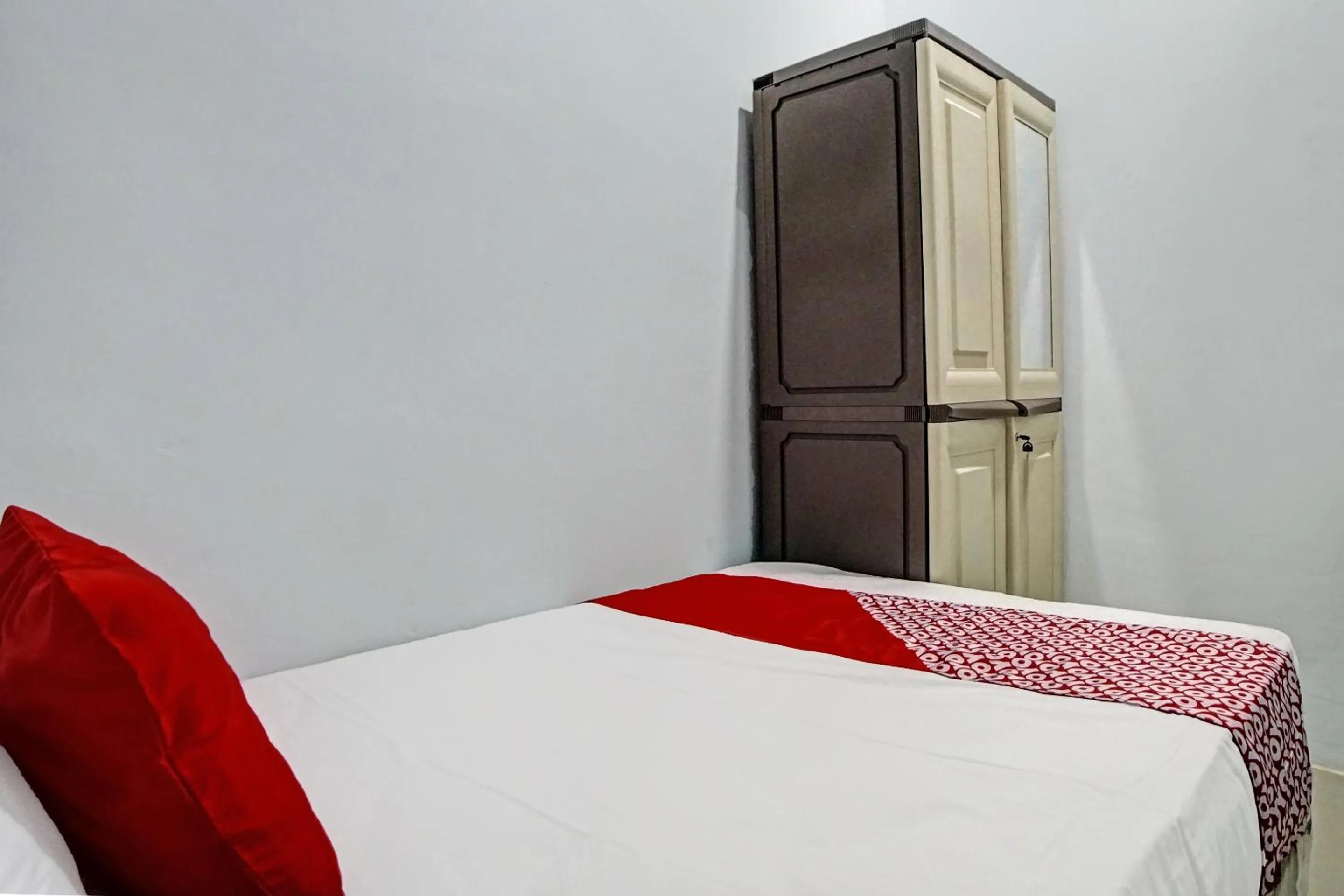 Bedroom in Hotel O Planet Guest House Syariah
