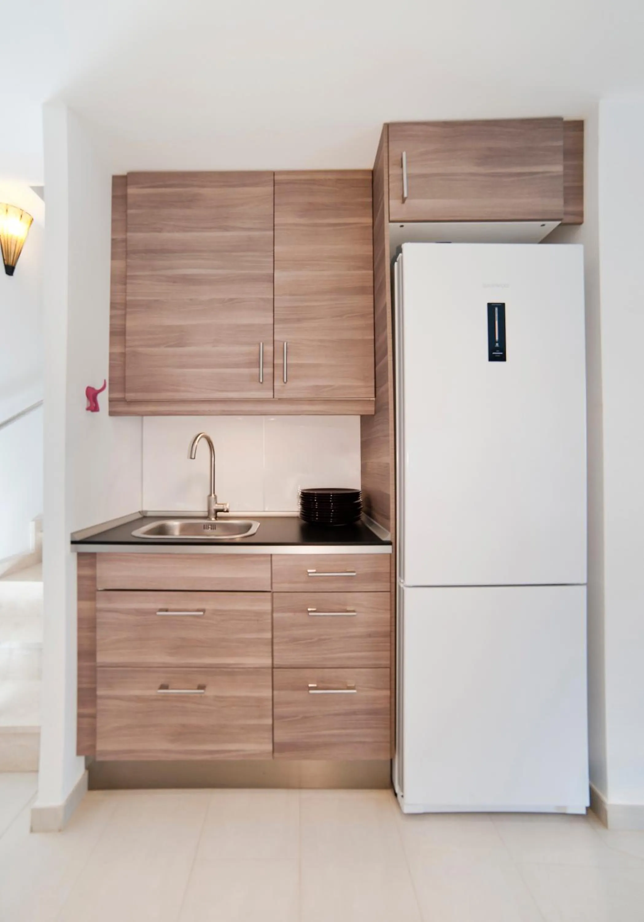 Kitchen or kitchenette in Modern Duplex in Sitges with Private Parking, Sea Views & Terrace