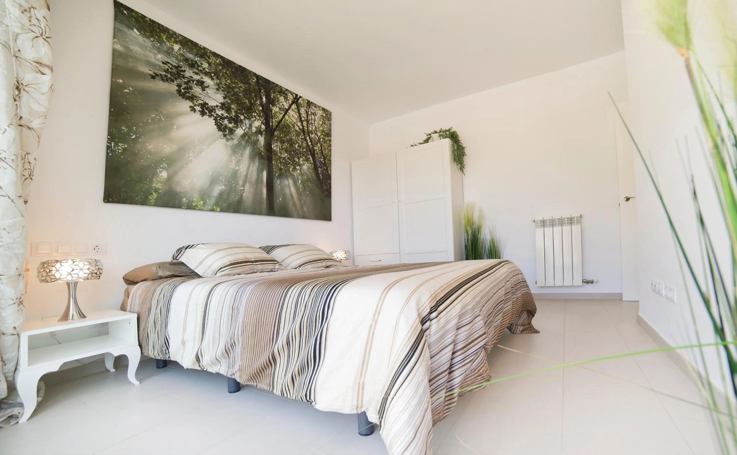 Bed in Modern Duplex in Sitges with Private Parking, Sea Views & Terrace