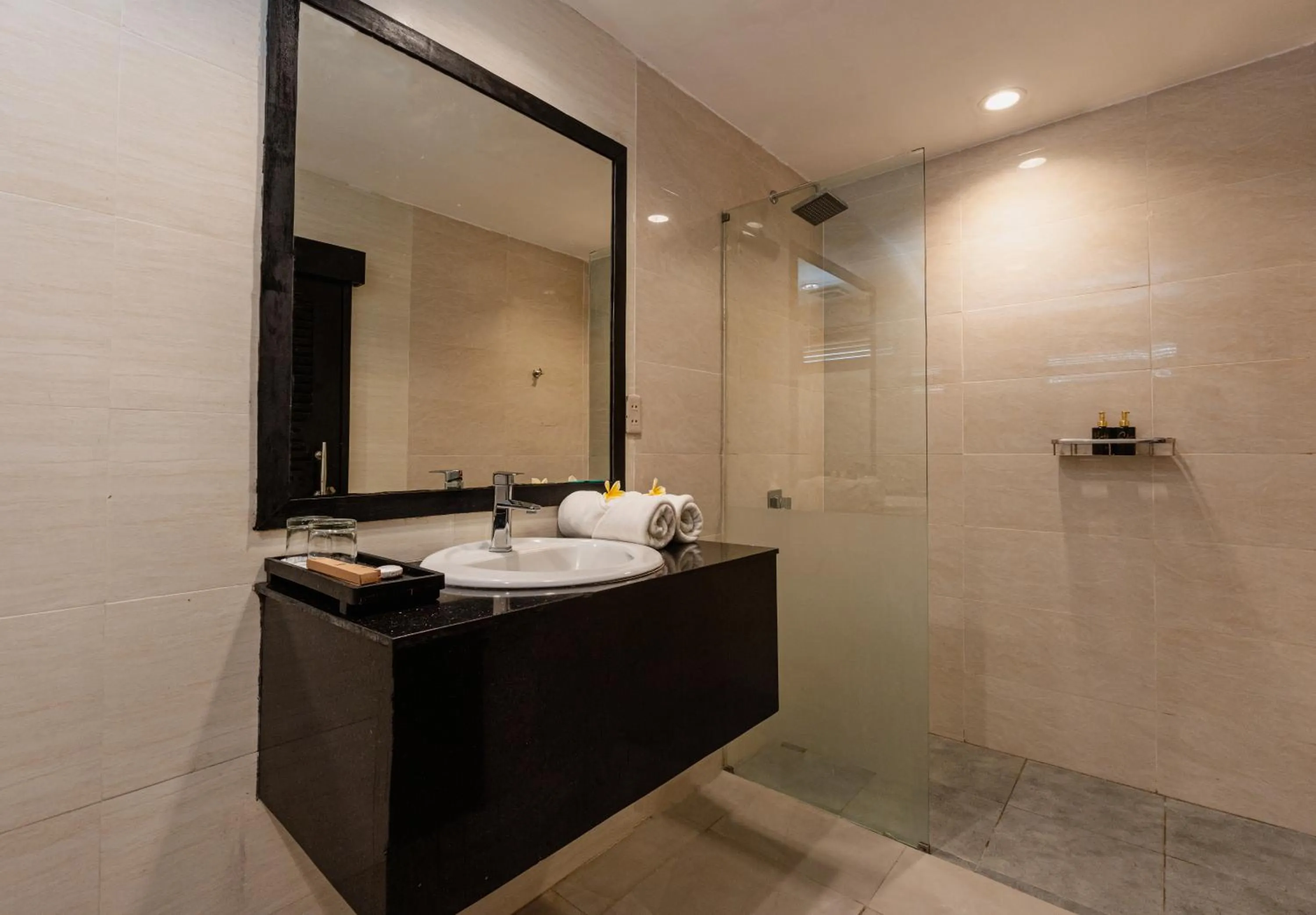 Bathroom in Casa Wina Kuta Managed by ARM Hospitality