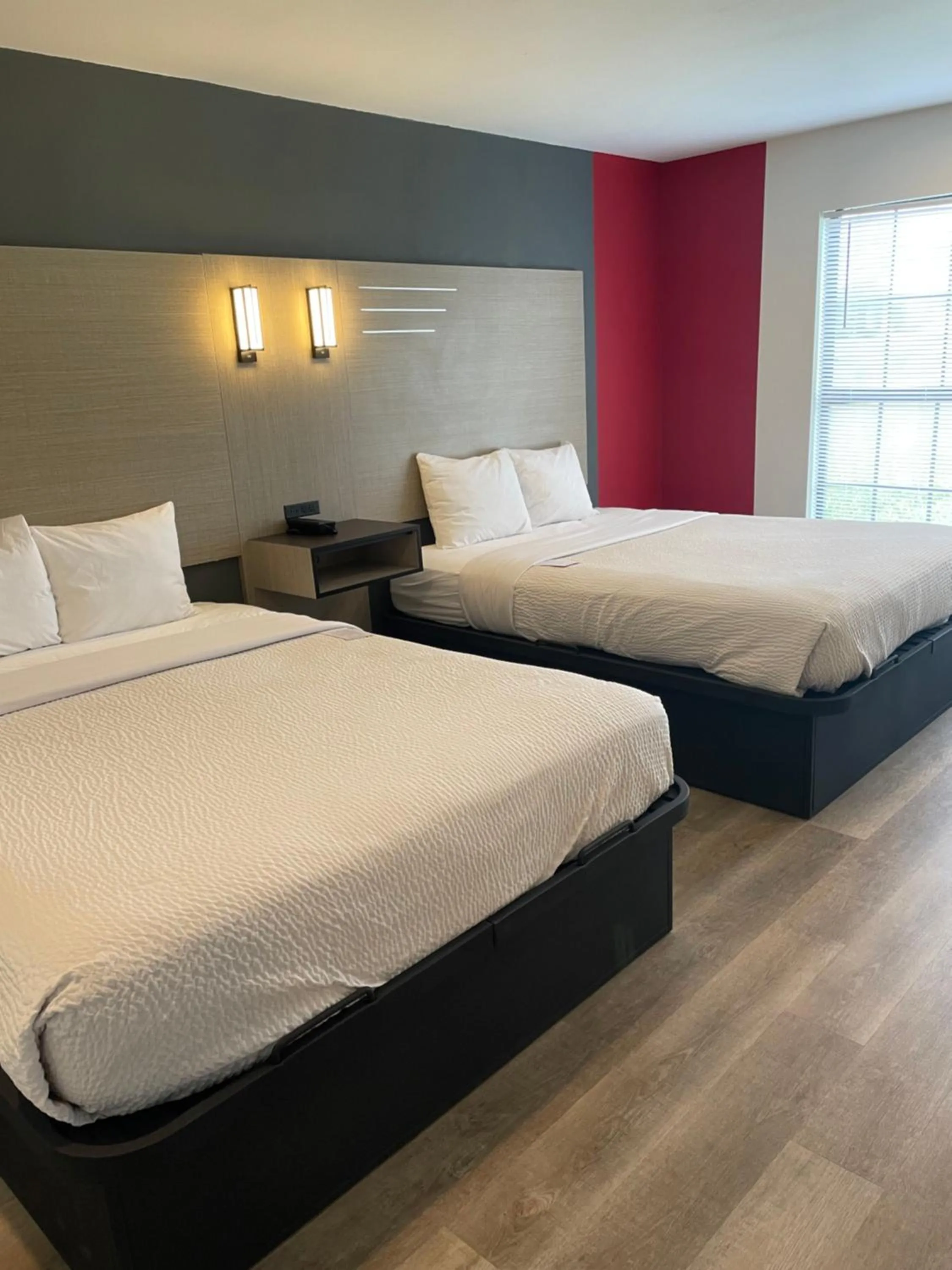 Bed in Ramada by Wyndham Studio Suites Dothan