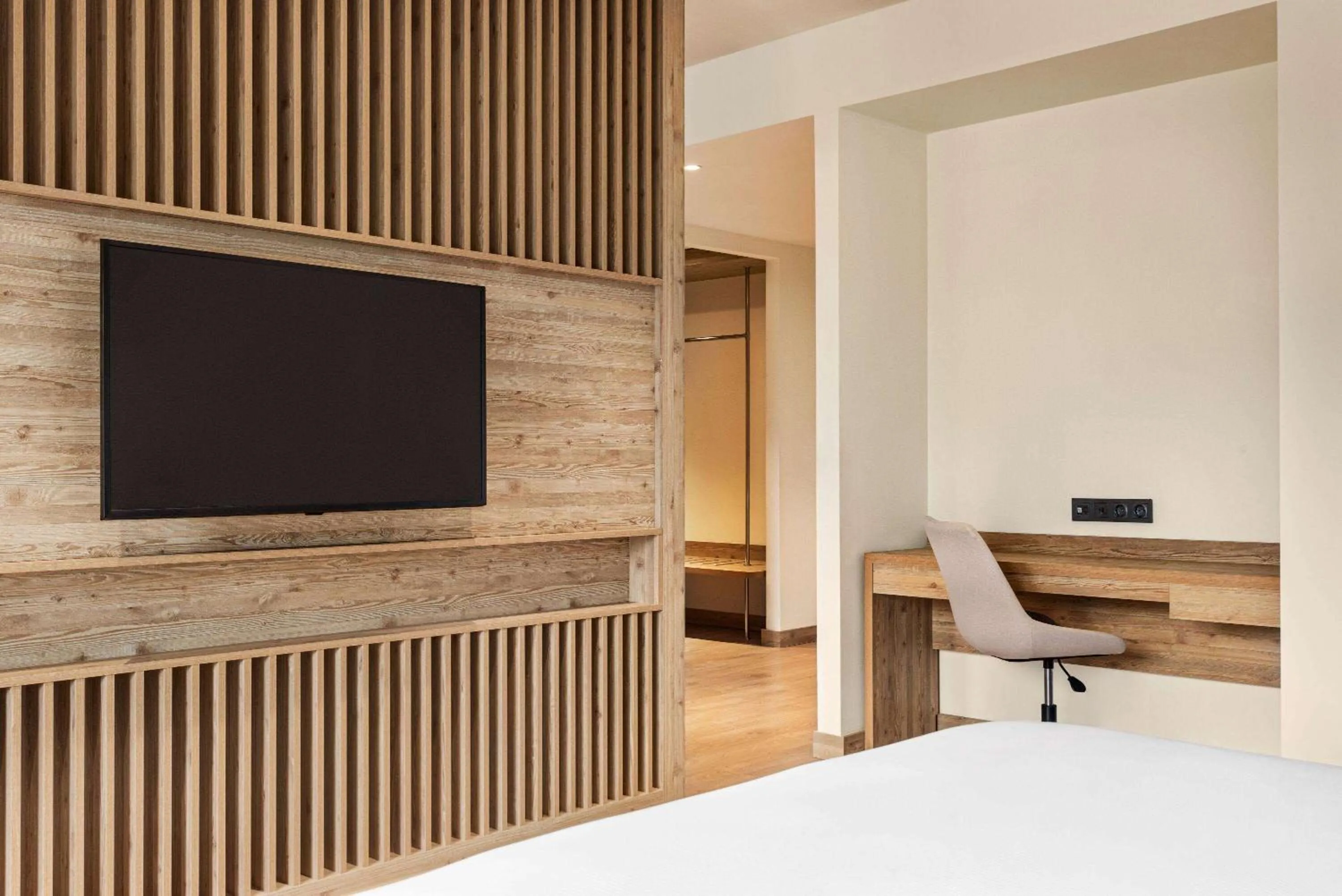 Bed in Ramada Encore by Wyndham Zomin