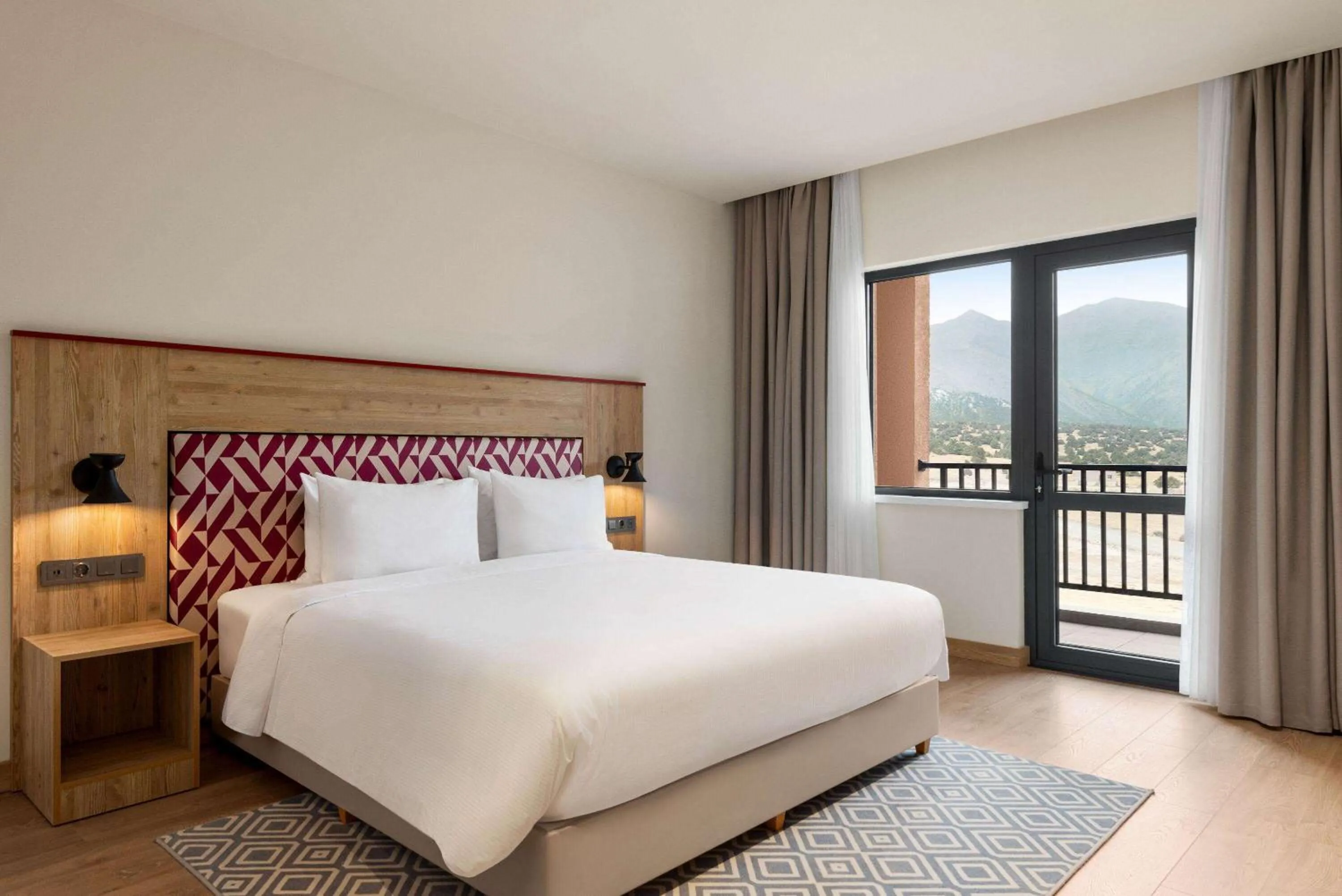 Bed in Ramada Encore by Wyndham Zomin