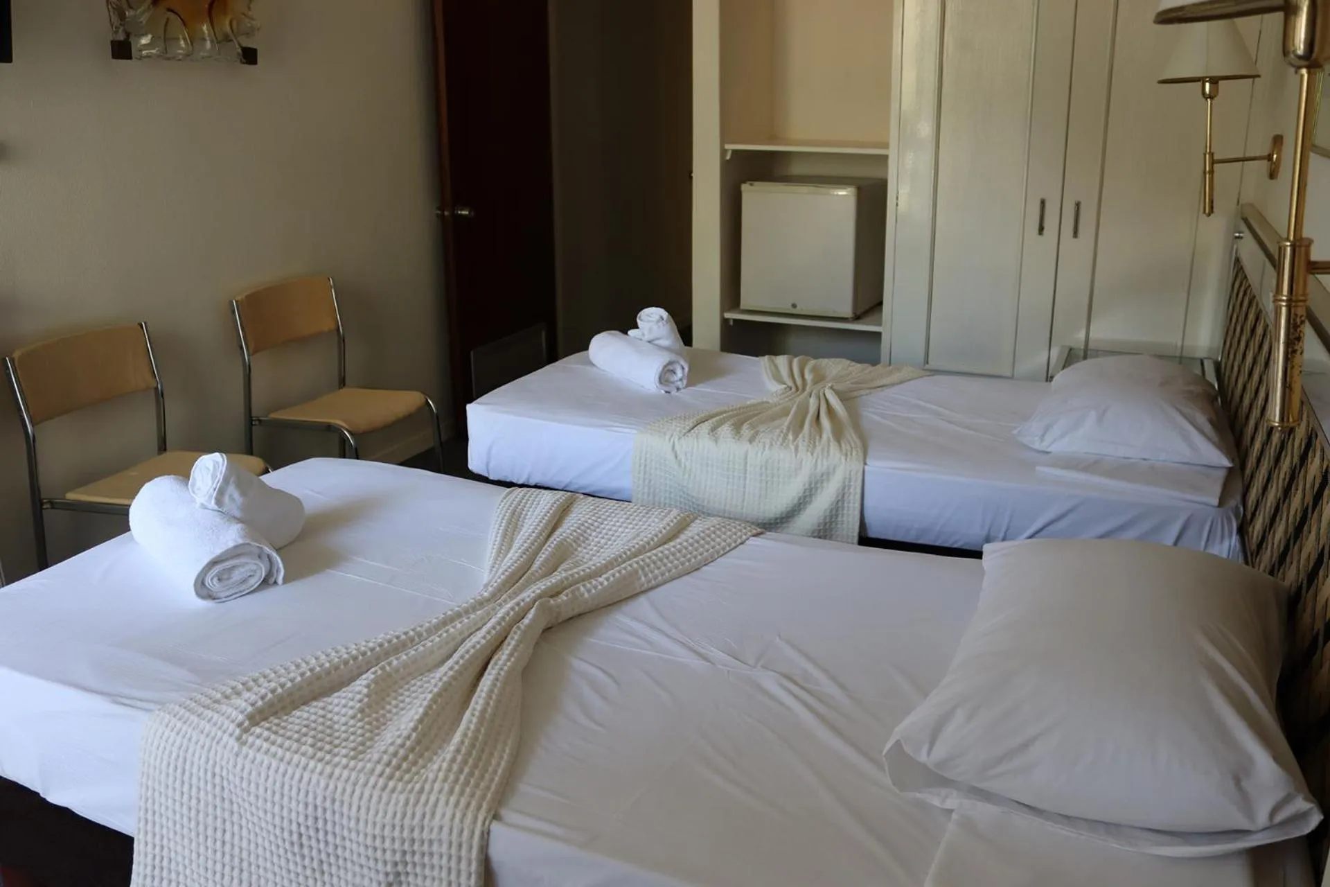 Bed in Hotel Theoxenia