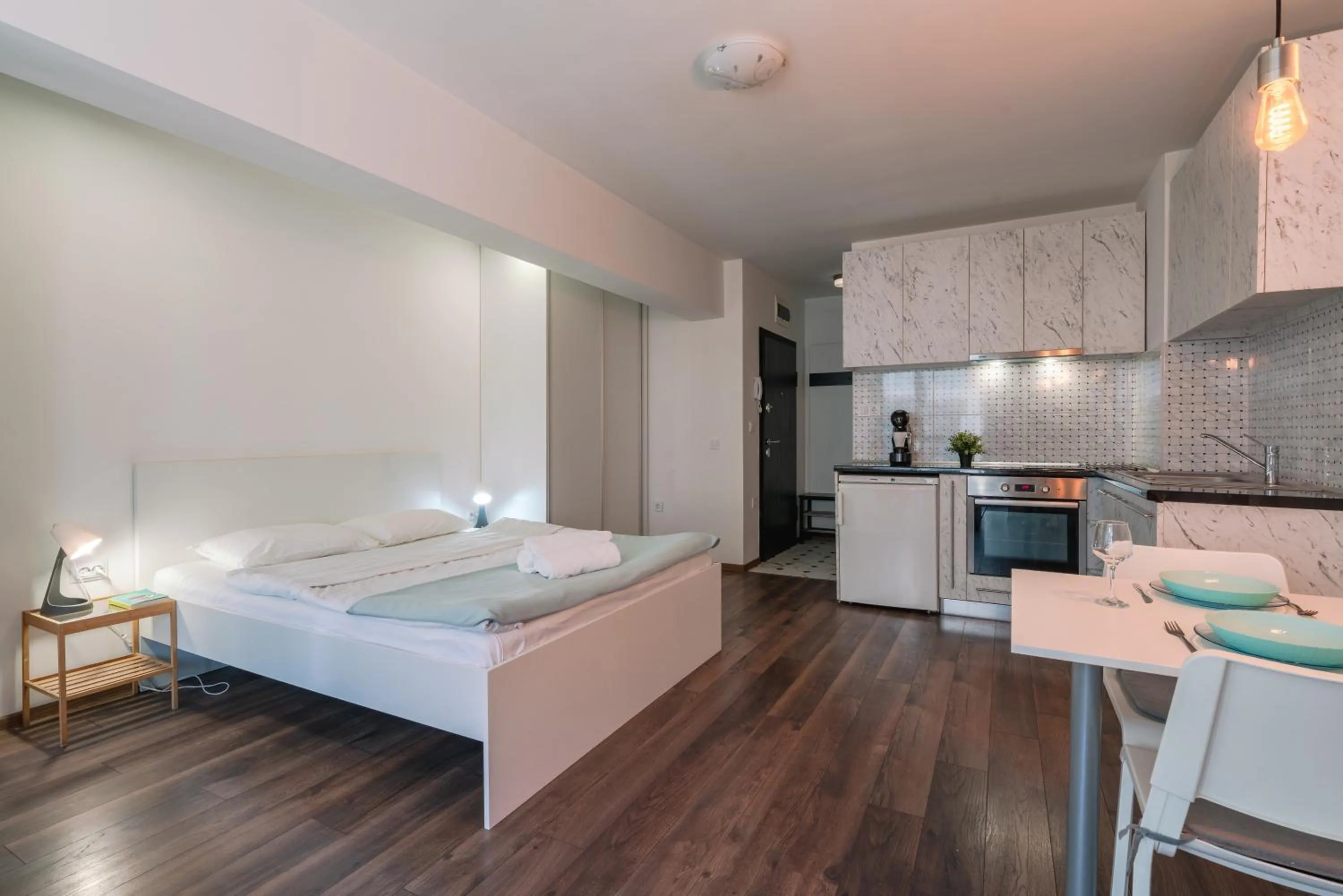 Photo of the whole room, Bed in Bright Studio in the City Center