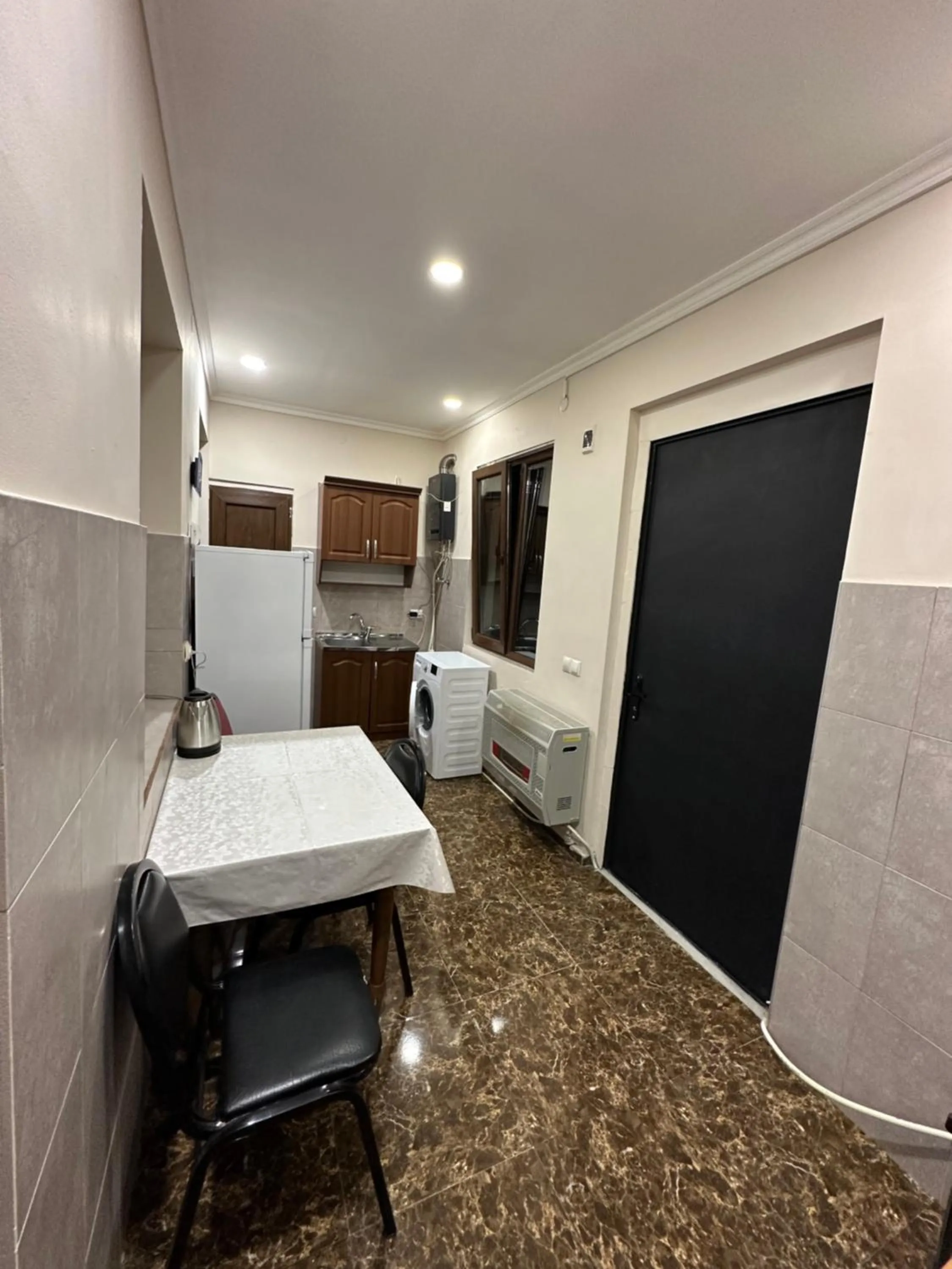 Kitchen or kitchenette in Meshia Apartment