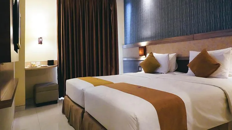 Bed in Crystal Lotus Hotel Yogyakarta