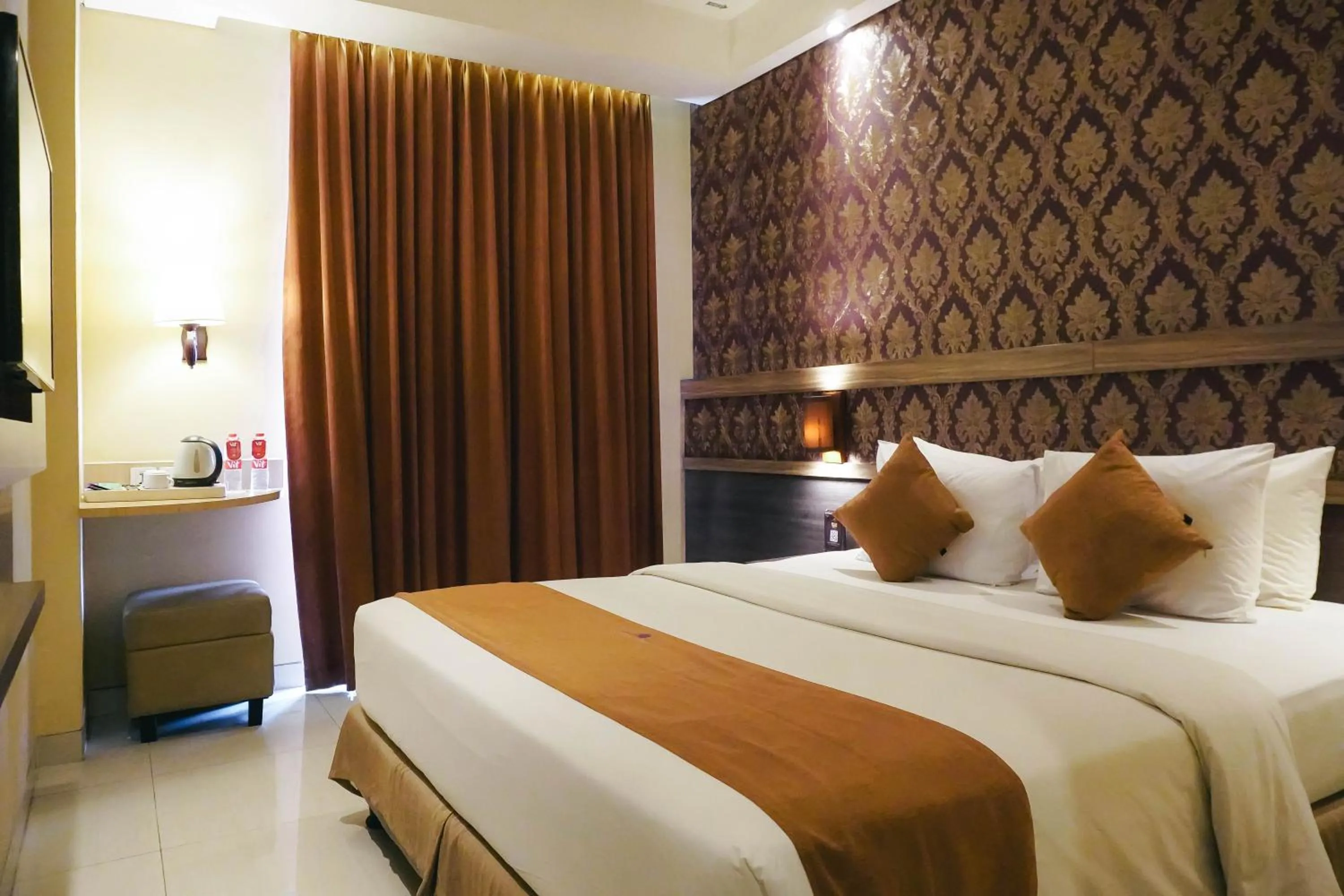 Bed in Crystal Lotus Hotel Yogyakarta