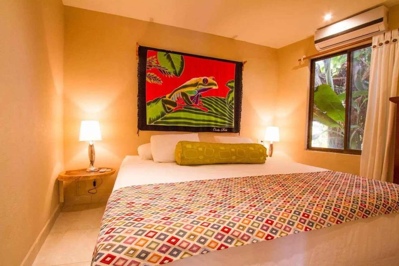 Bed in Tamarindo Village Hotel