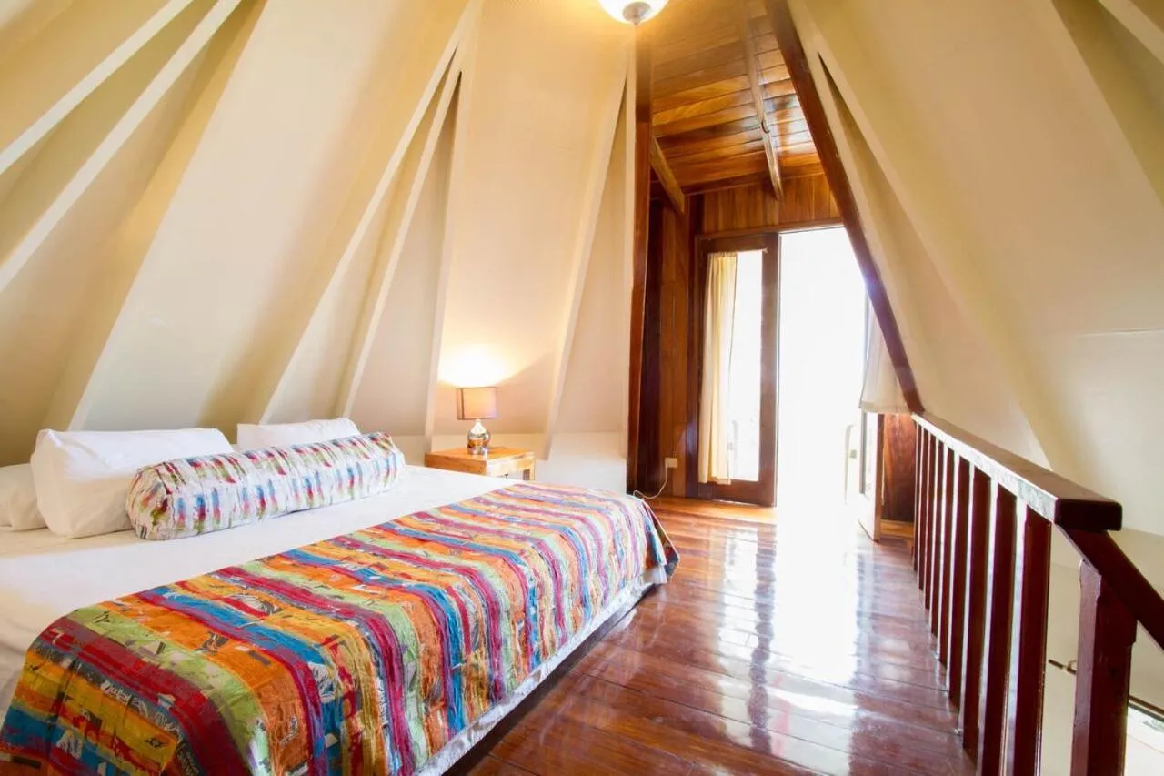 Bed in Tamarindo Village Hotel