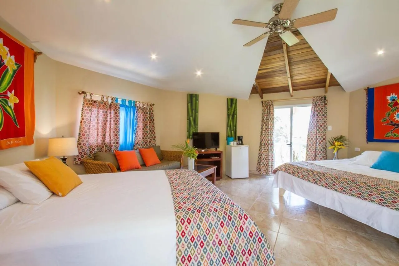 Bed in Tamarindo Village Hotel