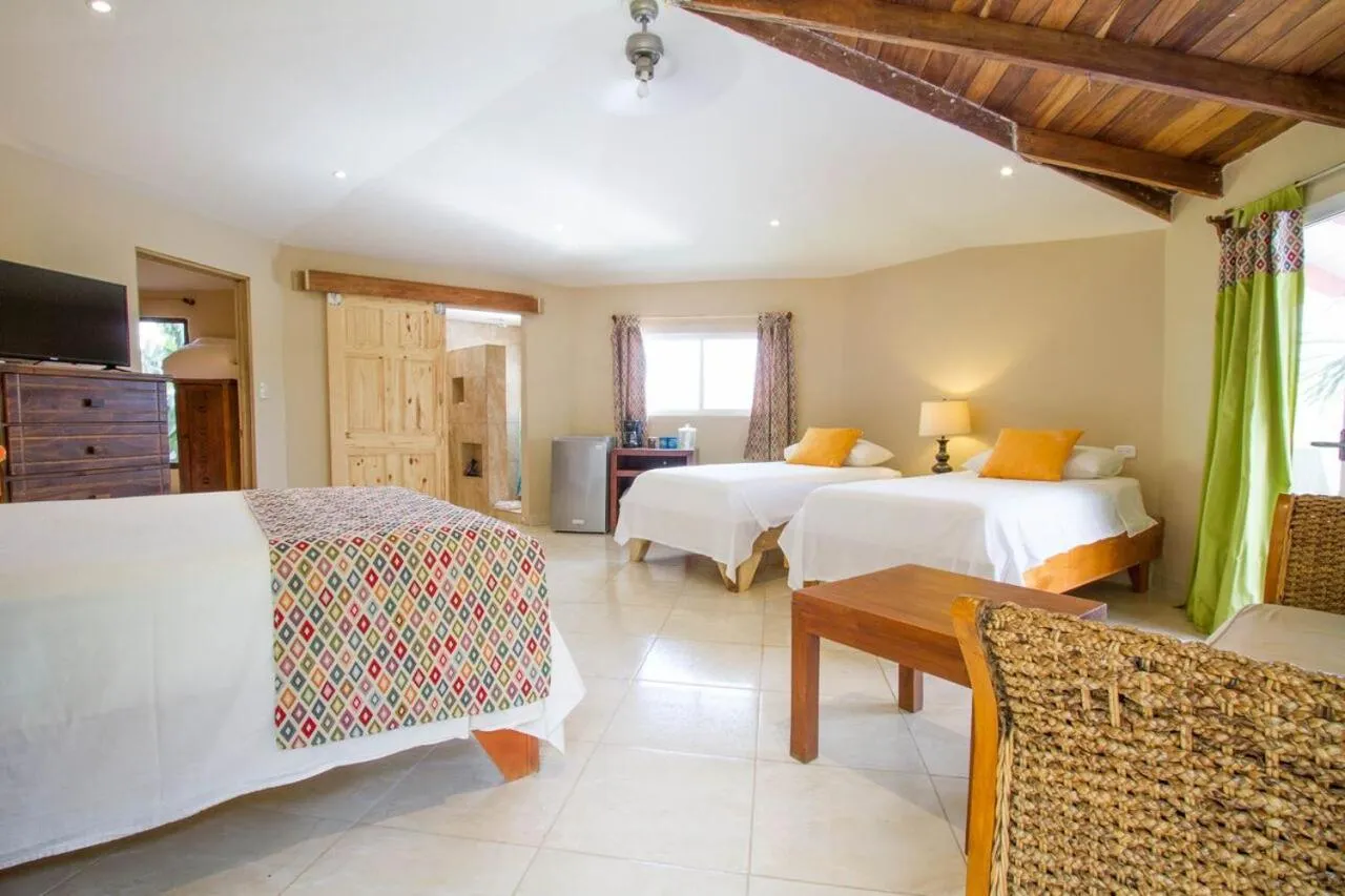 Bed in Tamarindo Village Hotel