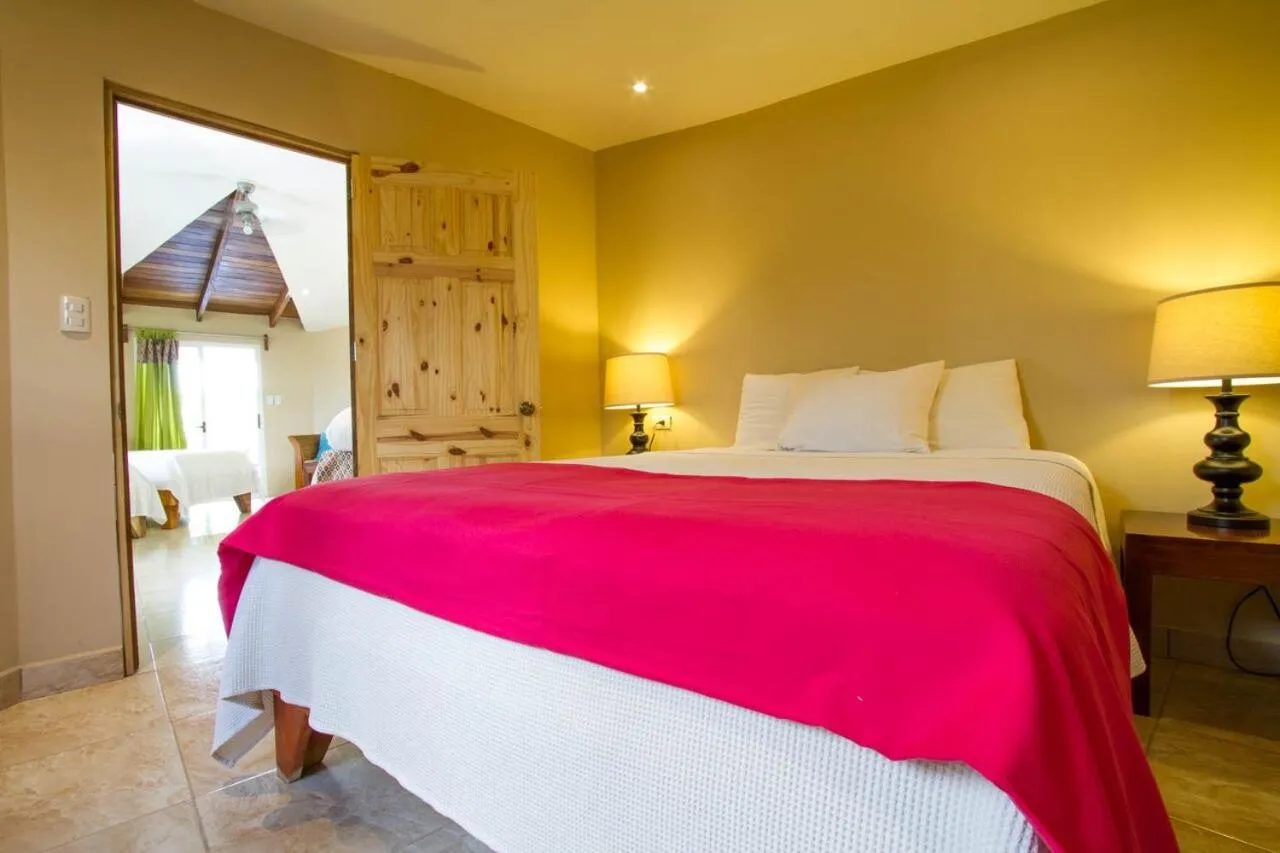 Bed in Tamarindo Village Hotel