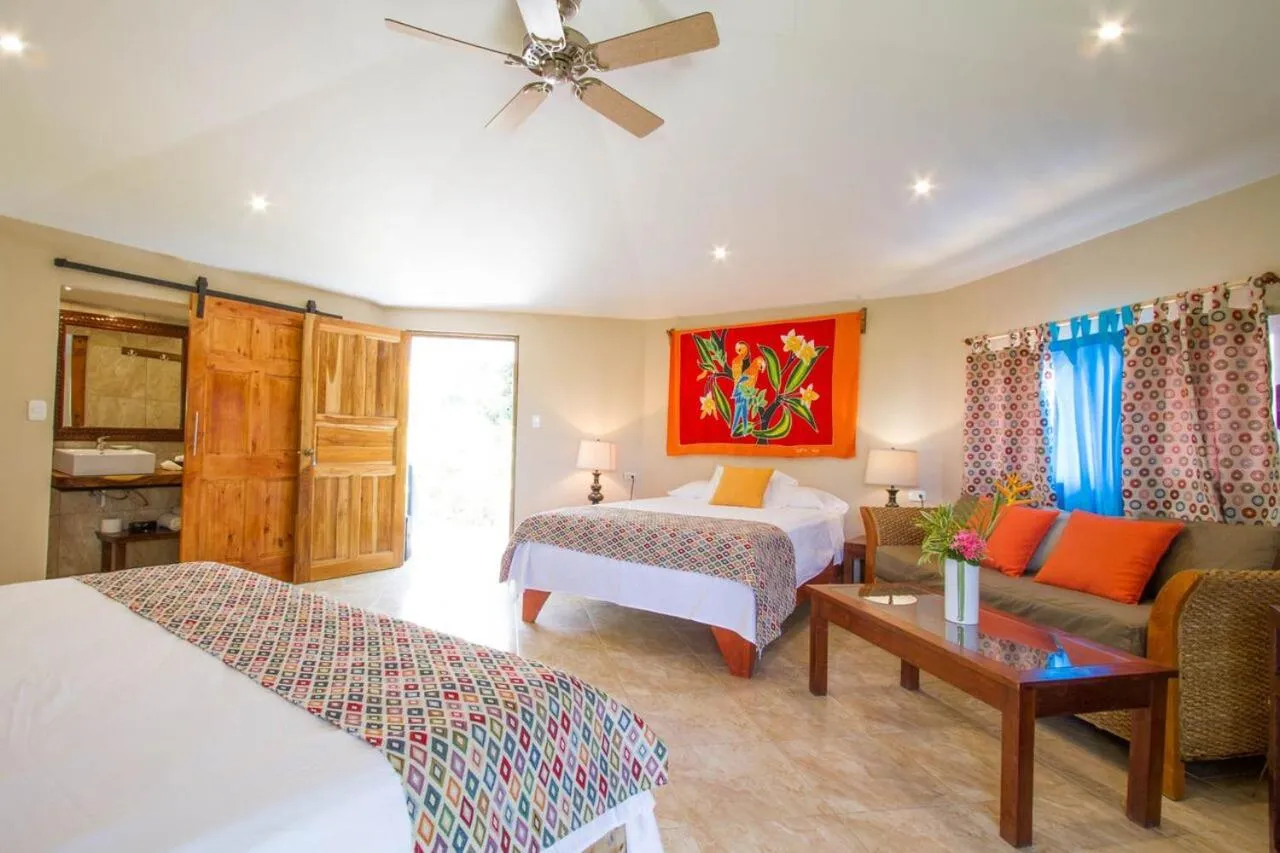 Bed in Tamarindo Village Hotel