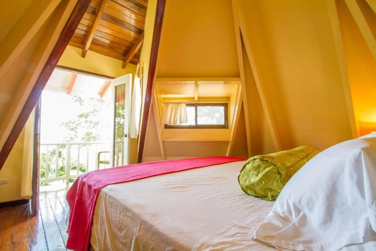 Bed in Tamarindo Village Hotel