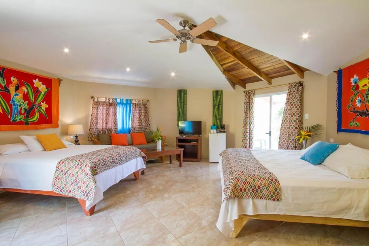 Bed in Tamarindo Village Hotel