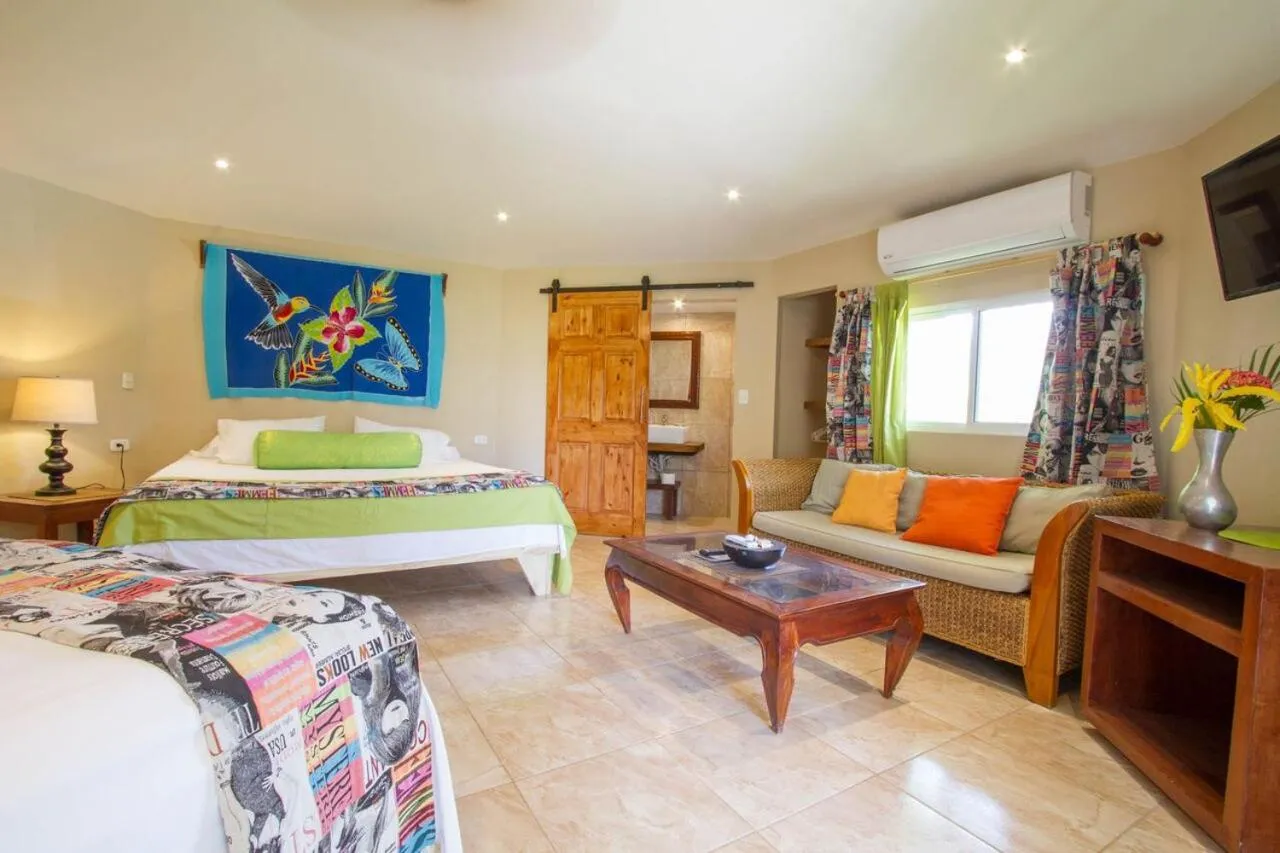 Bed in Tamarindo Village Hotel