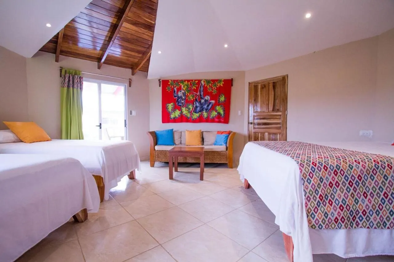 Bed in Tamarindo Village Hotel
