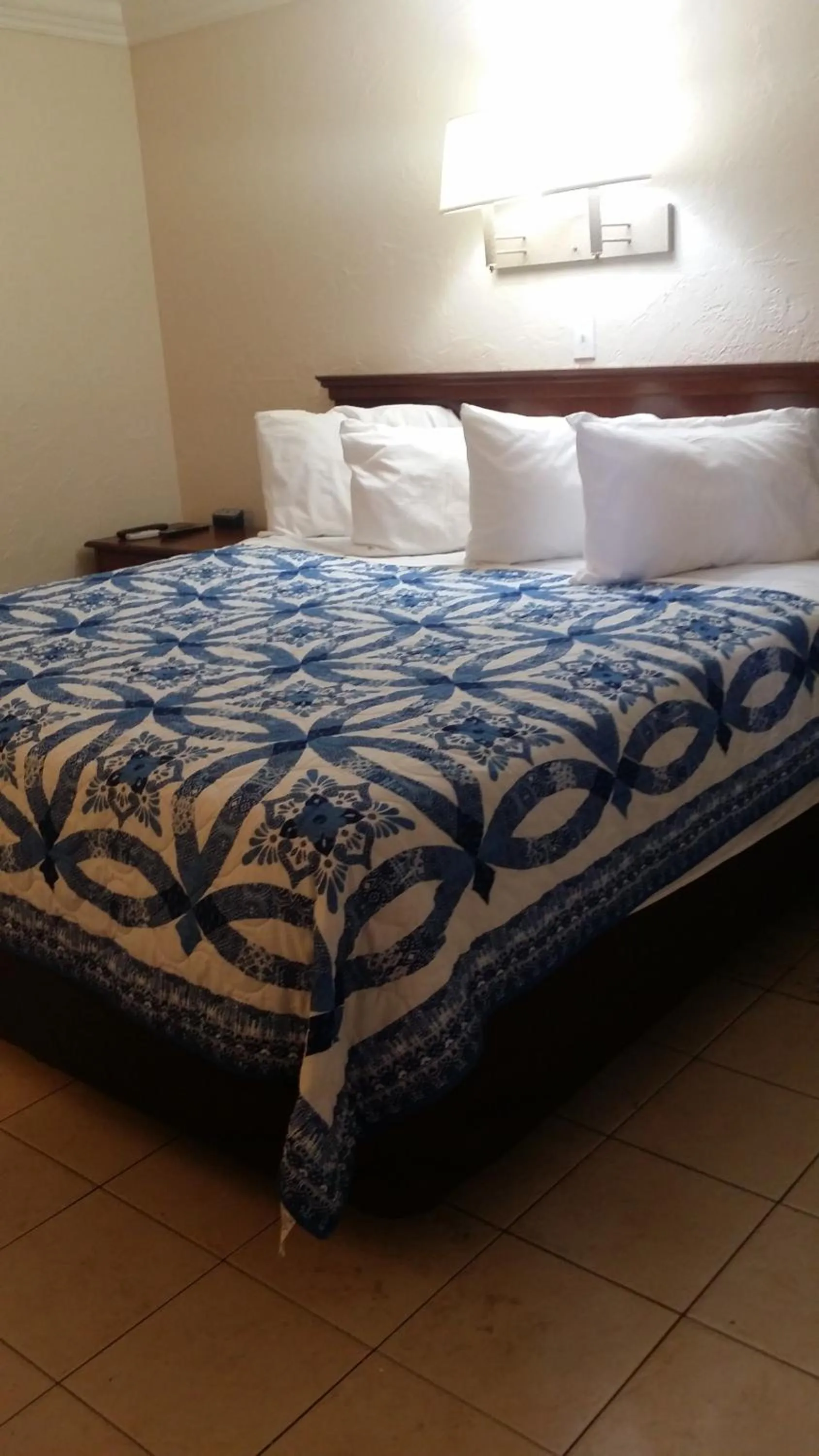 Bed in Palm Breeze Hotel